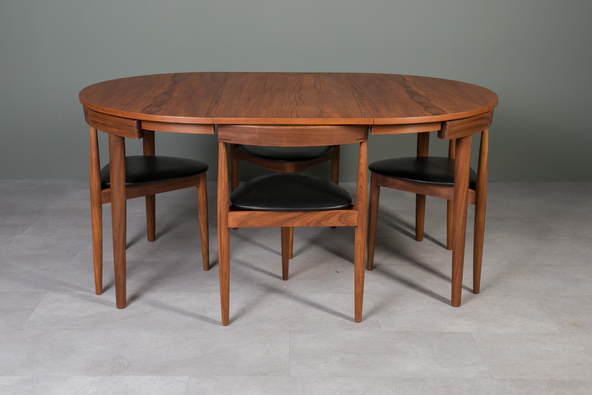 Rare “Roundette” dining set originally designed by Hans Olsen in 1952 for Frem Røjle this dining set has since become an icon of classic Danish Mid Century Modern Design. This gorgeous dining set features an extendable teak wood round table and four