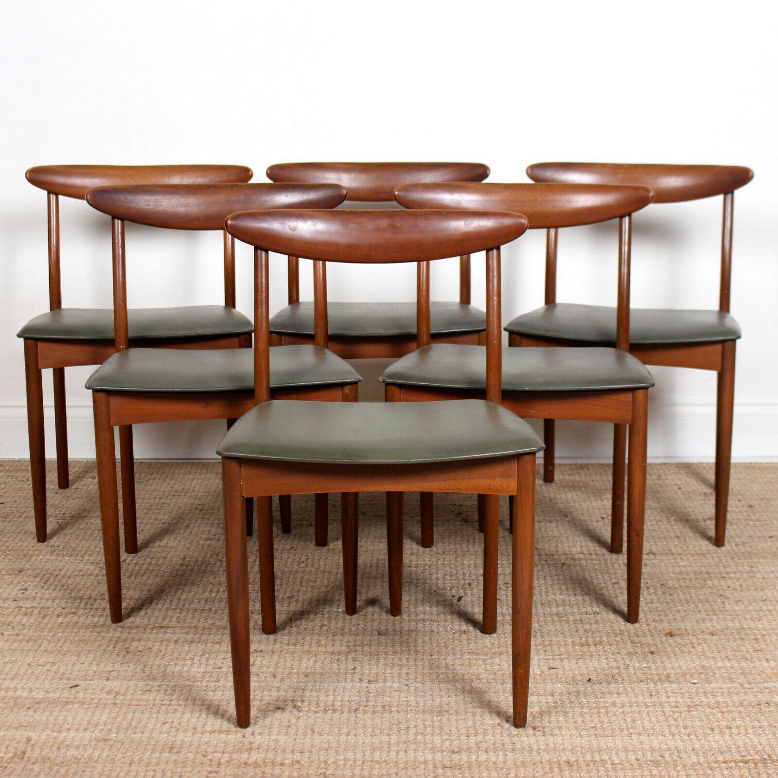 An impressive mid-20th century seven piece dining suite by Greaves & Thomas.

The dining table, extending by way of folding central leaf mechanism, raised on shaped tapering legs.

Offered in good condition. Some wear to edges of table and