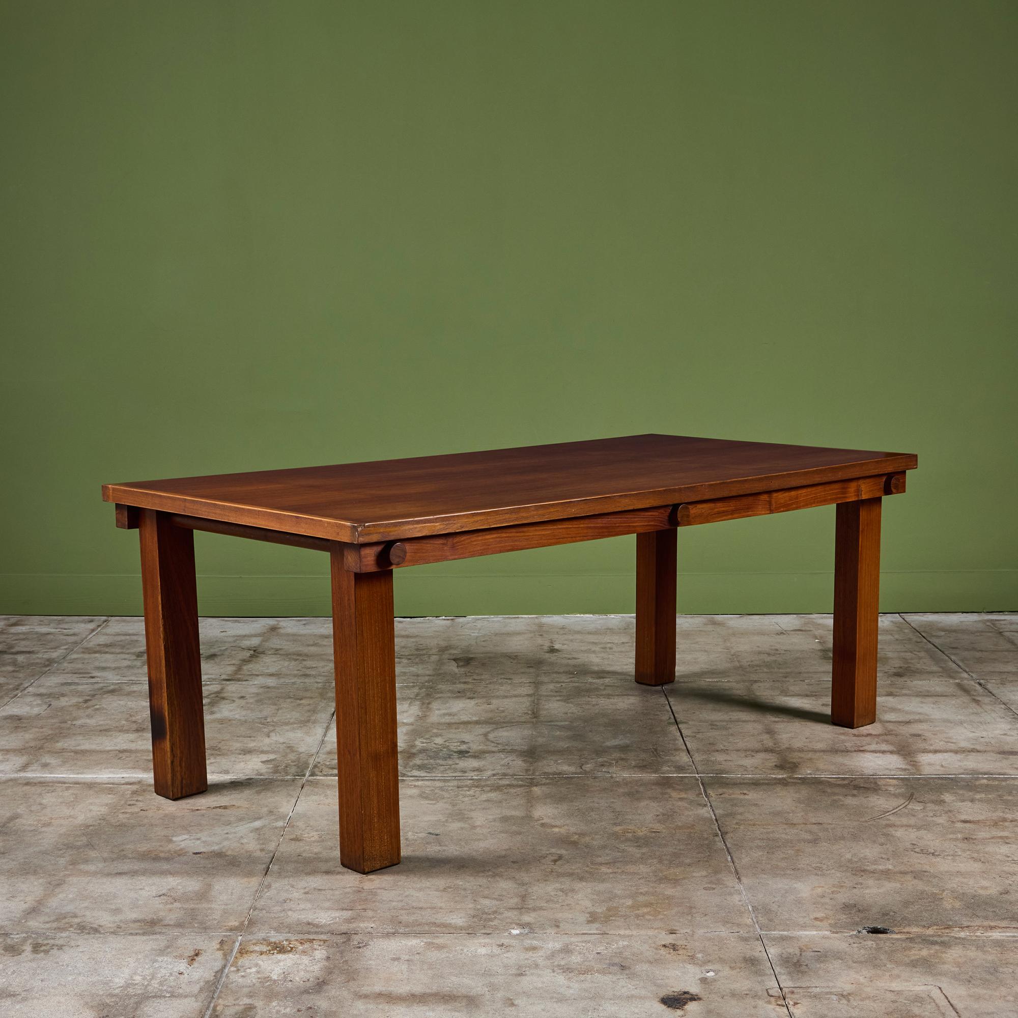 Rectangular teak dining table designed by Mini Boga for Taaru, c.1960s, India. This table features four block legs with dowel joinery, a simplistic design. Pairs beautifully with the Mini Boga woven chairs.

Dimensions
72