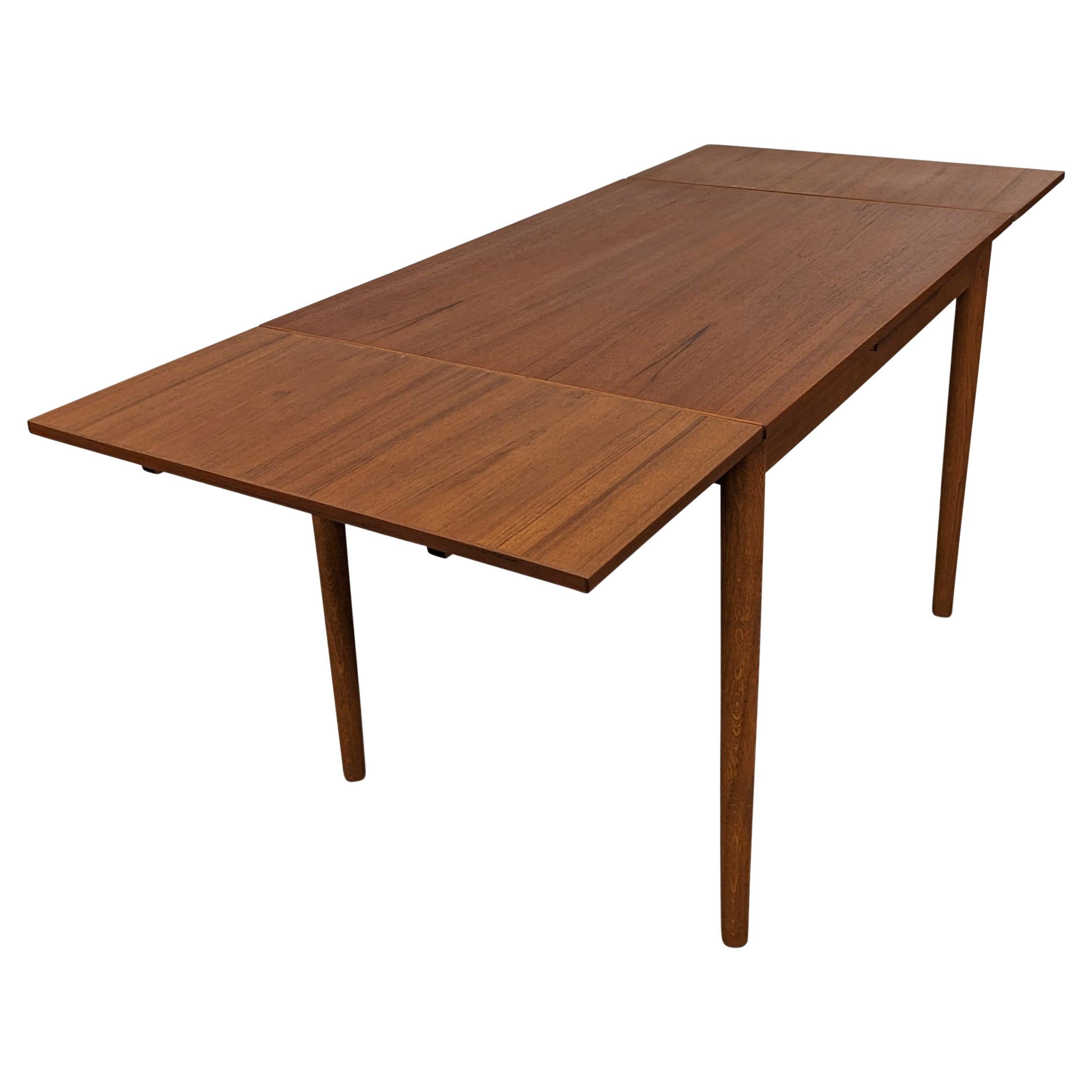 Midcentury Danish Teak Extending Dining Table with 2 Leaves For Sale at 1stDibs