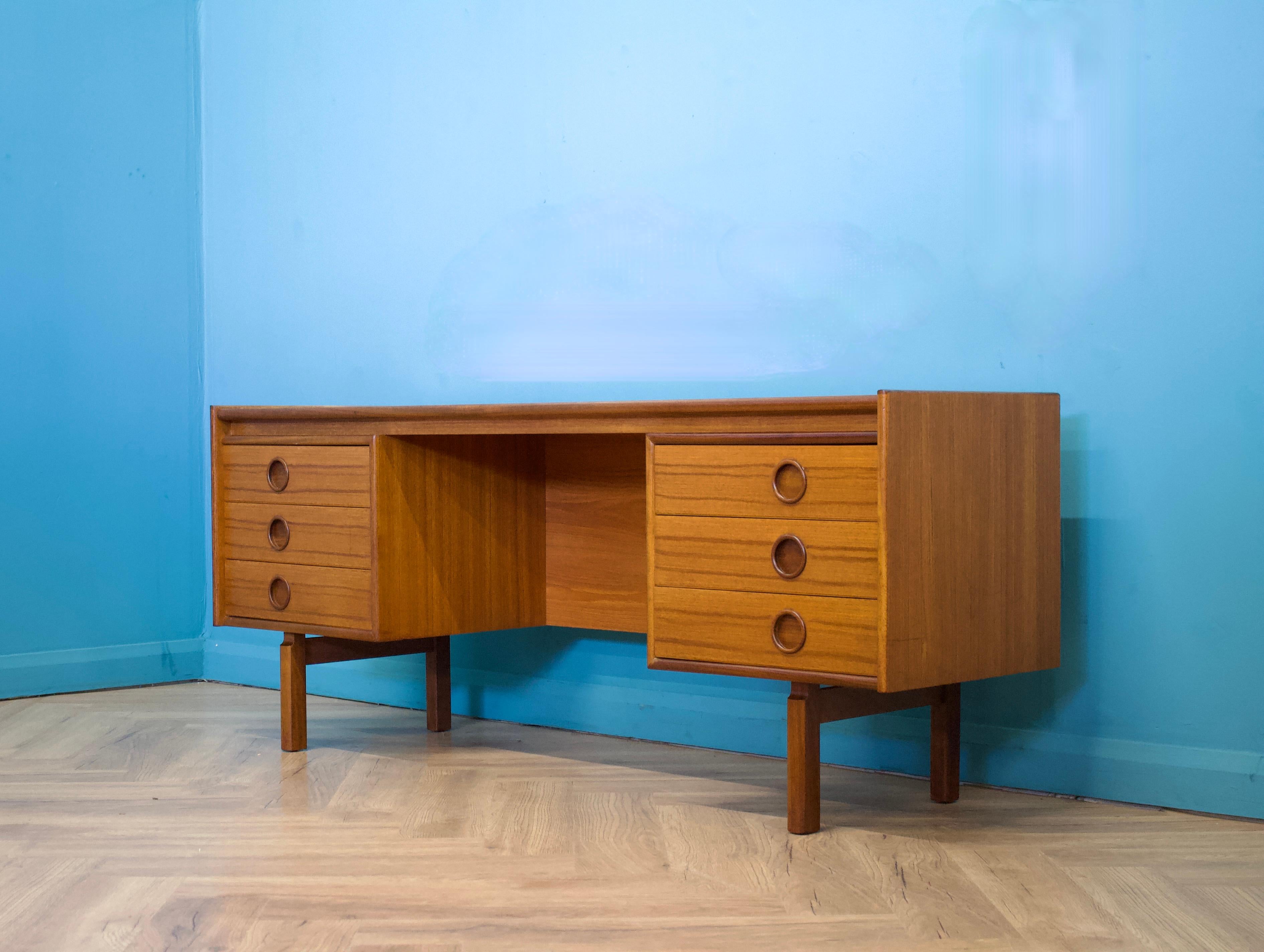 A mid century teak dressing table from Bath Cabinet Makers, circa 1960s


The original fixed mirror has been removed - to use this piece as a dressing table, a freestanding mirror can be used in its place.
Alternitively it would function as a