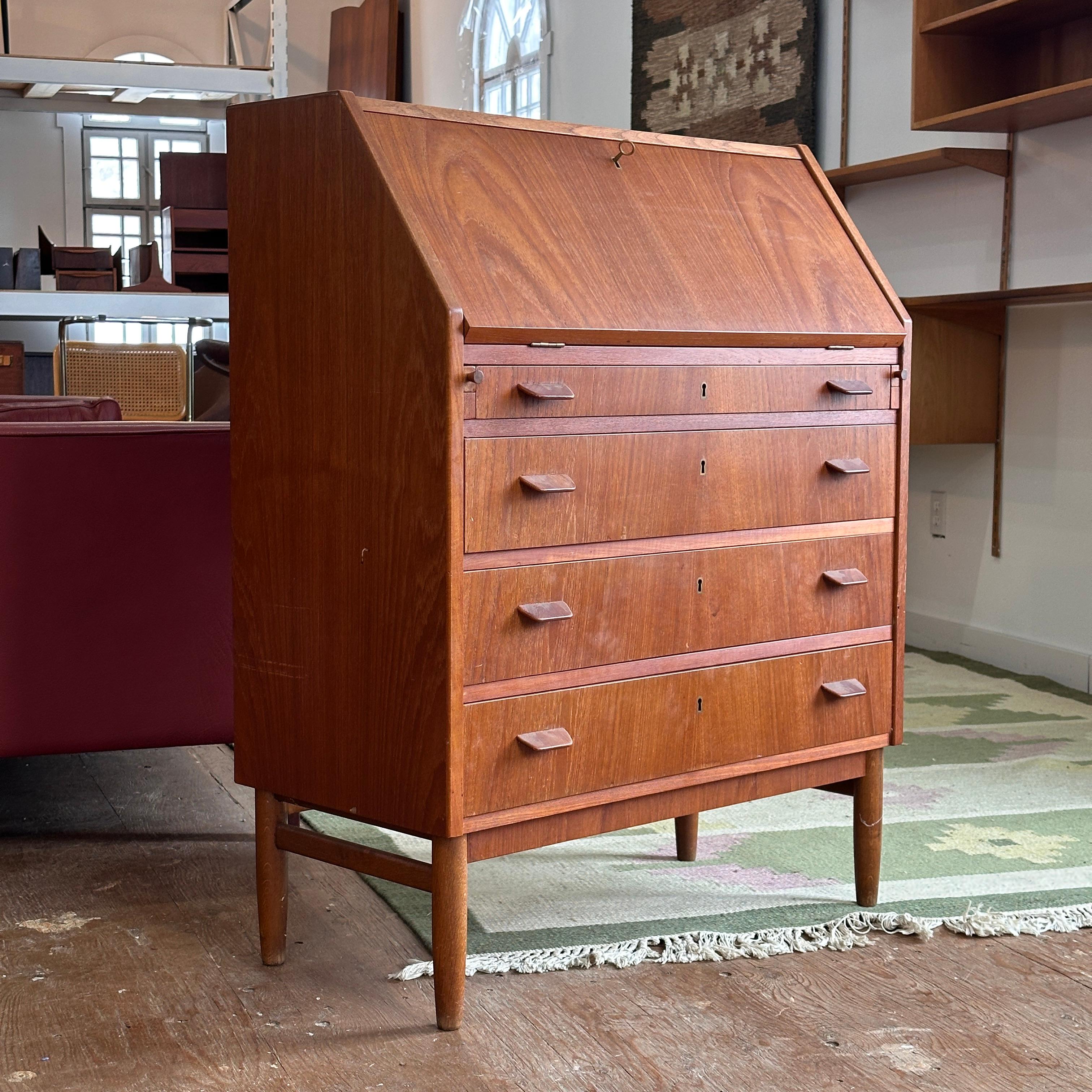 Condition: Pre-Restored

Dimensions: 33” L x 16.5” D x 42.25” H (30.75” Desk Height)

Description: A vintage teak drop front desk with drawers. All locks work and comes with key. Freshly imported from Denmark.

Turn-around time 3-4 weeks after