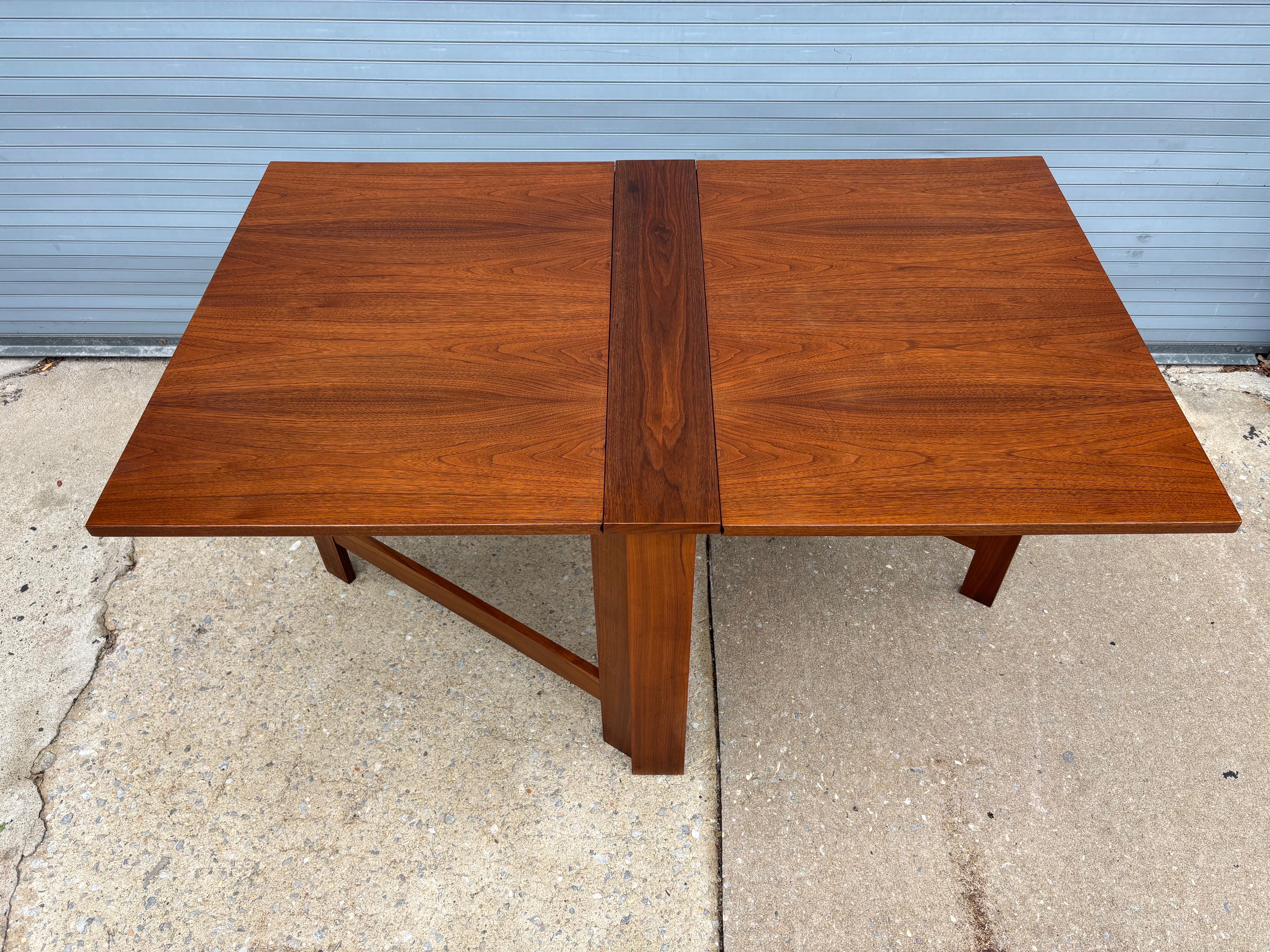 Nice Teak Drop-Leaf Table!  Can be used with one or two leaves opened.  Perfect for against the wall or center stage!  2 Tables Available.  Newly refinished!  Each leaf is 25.5 long and center is 6
