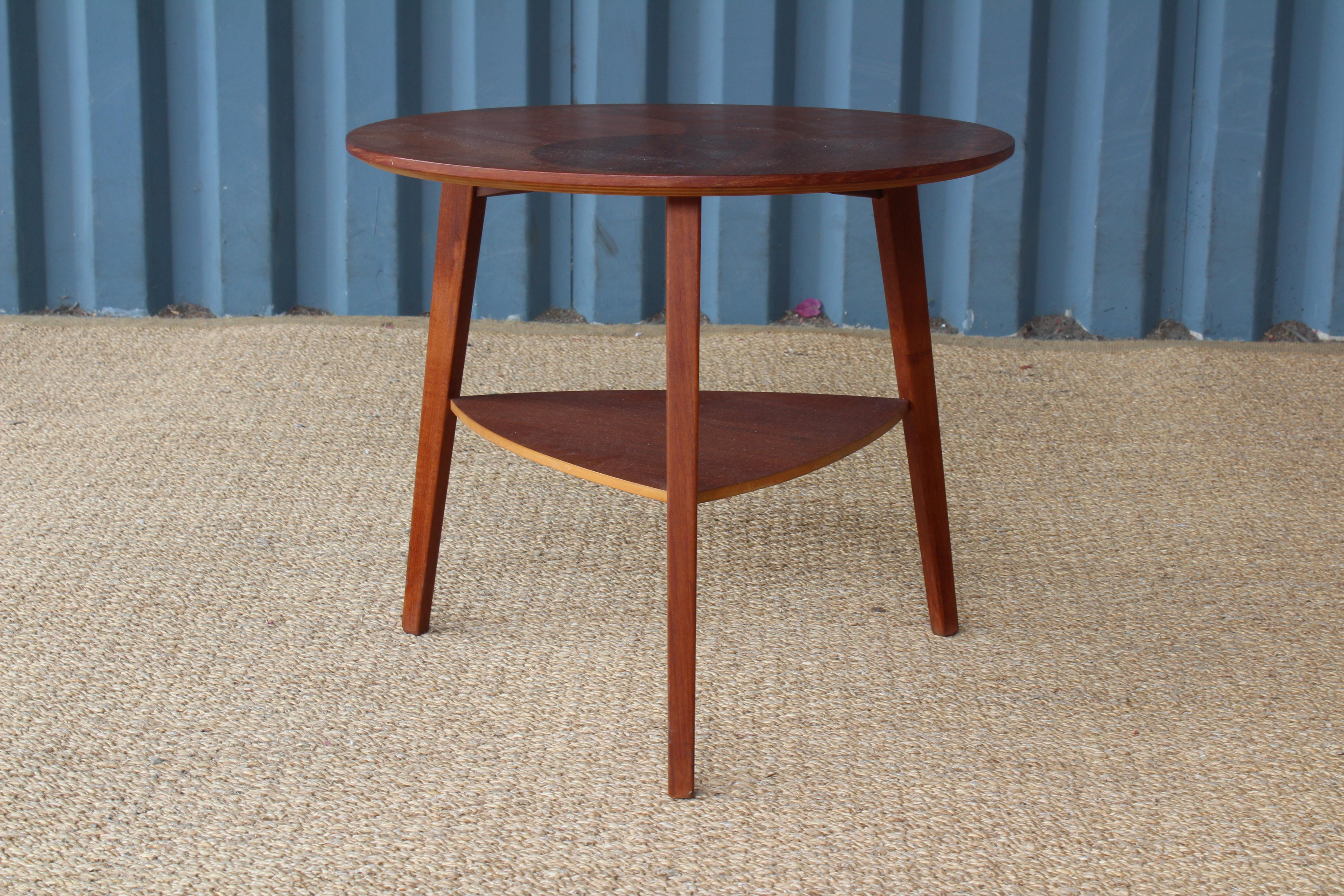 Teak end table with a pattern inlaid veneer surface, made in Denmark in the 1950s.