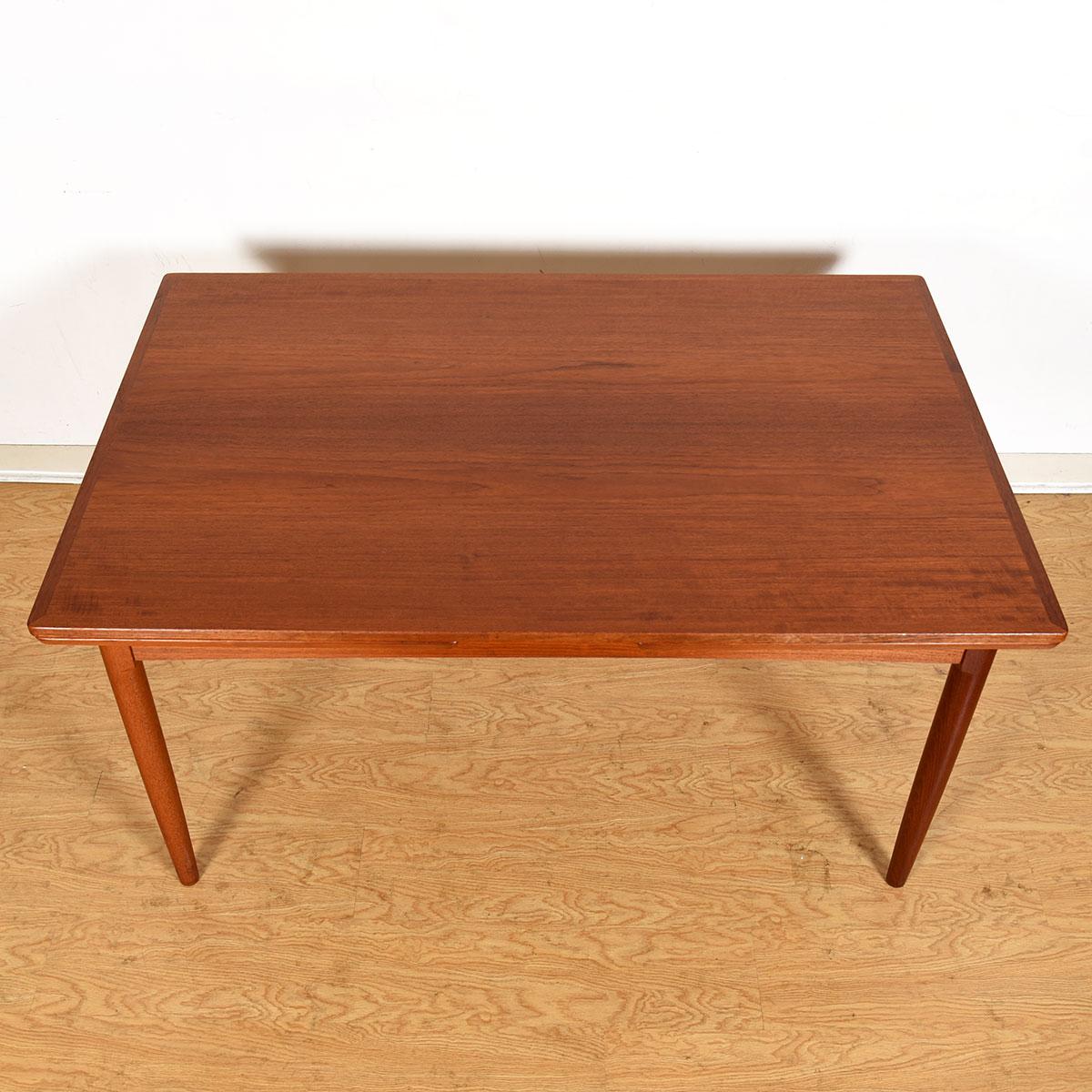 Teak Expanding Danish Modern Mid-Sized Dining Table

Additional information:
Material: Teak

Two Self-Storing Leaves Pull Out From Under The Table’s Top From Either End, Each Adding Approximately 23.5?

Dimension: W 56.75? - 80.25? - 103.75?? x D