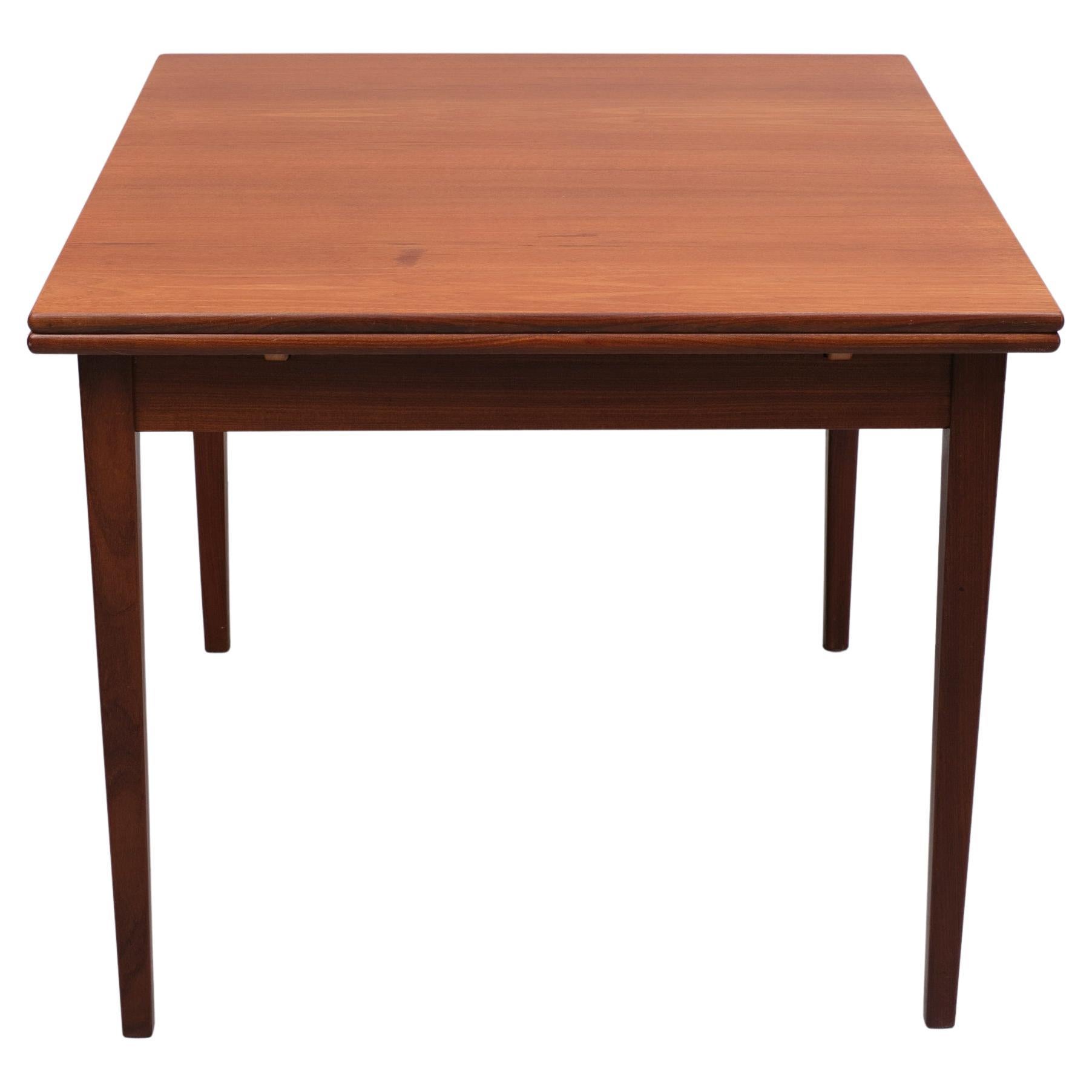 Teak extendable dining table  1960s  For Sale