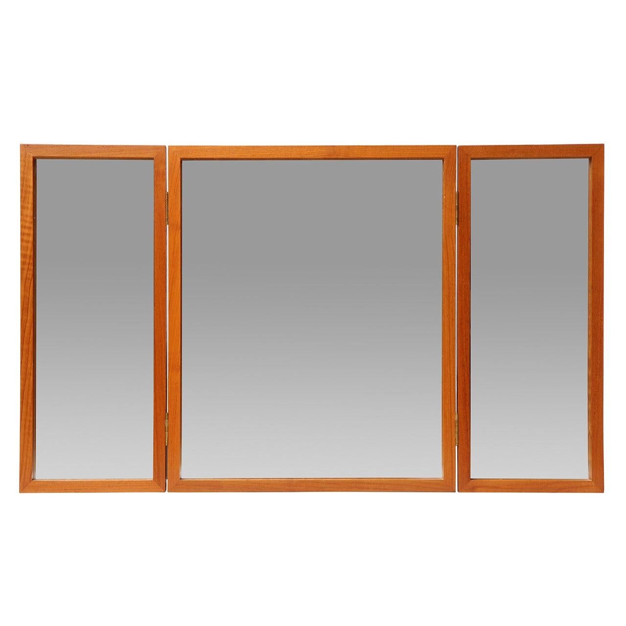 An impeccably crafted, in rich teak, folding tabletop vanity mirror that can also be wall-mounted.