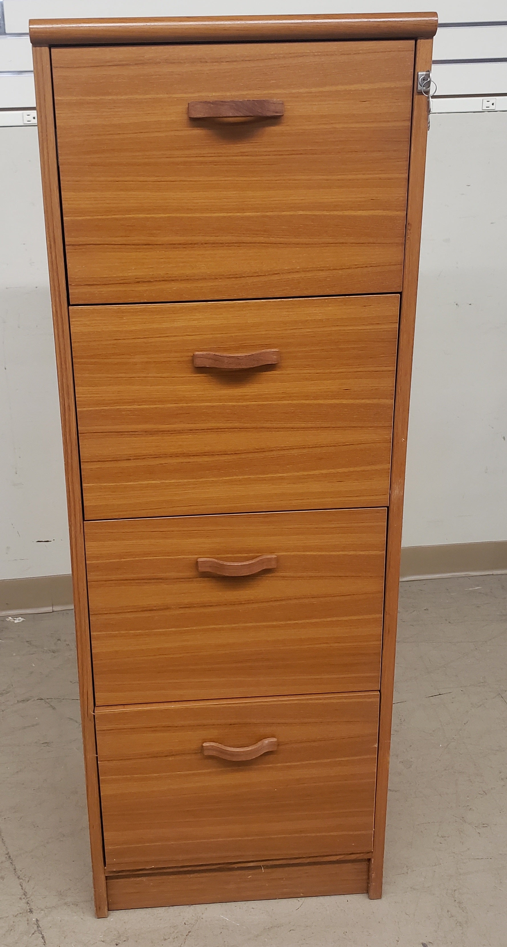 Teak four drawer vertical locking filing cabinet. Two keys available lock all 4 drawers. Build-in file folder handging rails.
Excellent vintage condition.