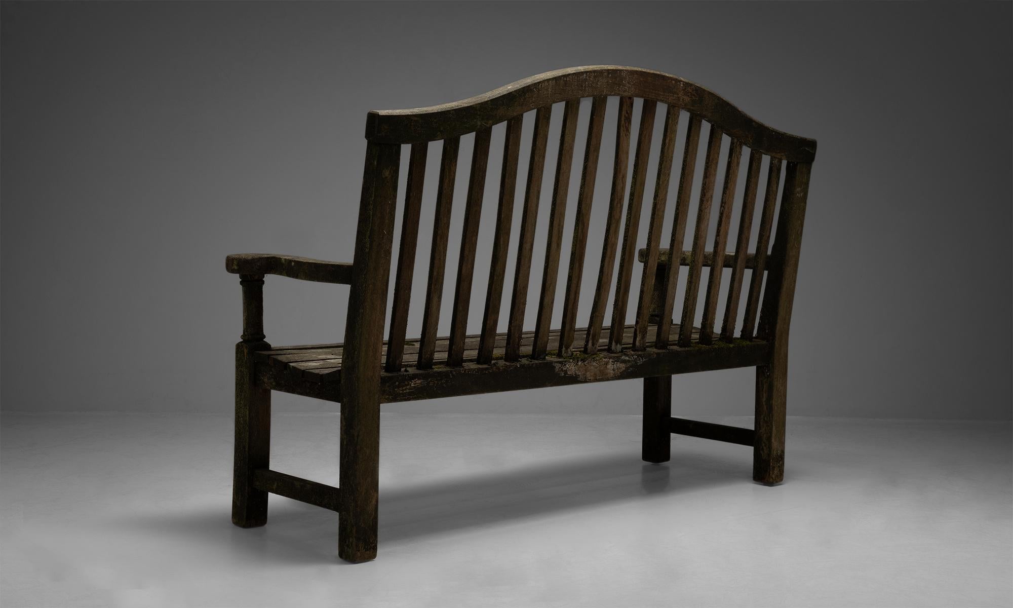 Teak garden bench

England, Circa 1970

Slatted garden bench in weathered finish with natural patina and lichen.