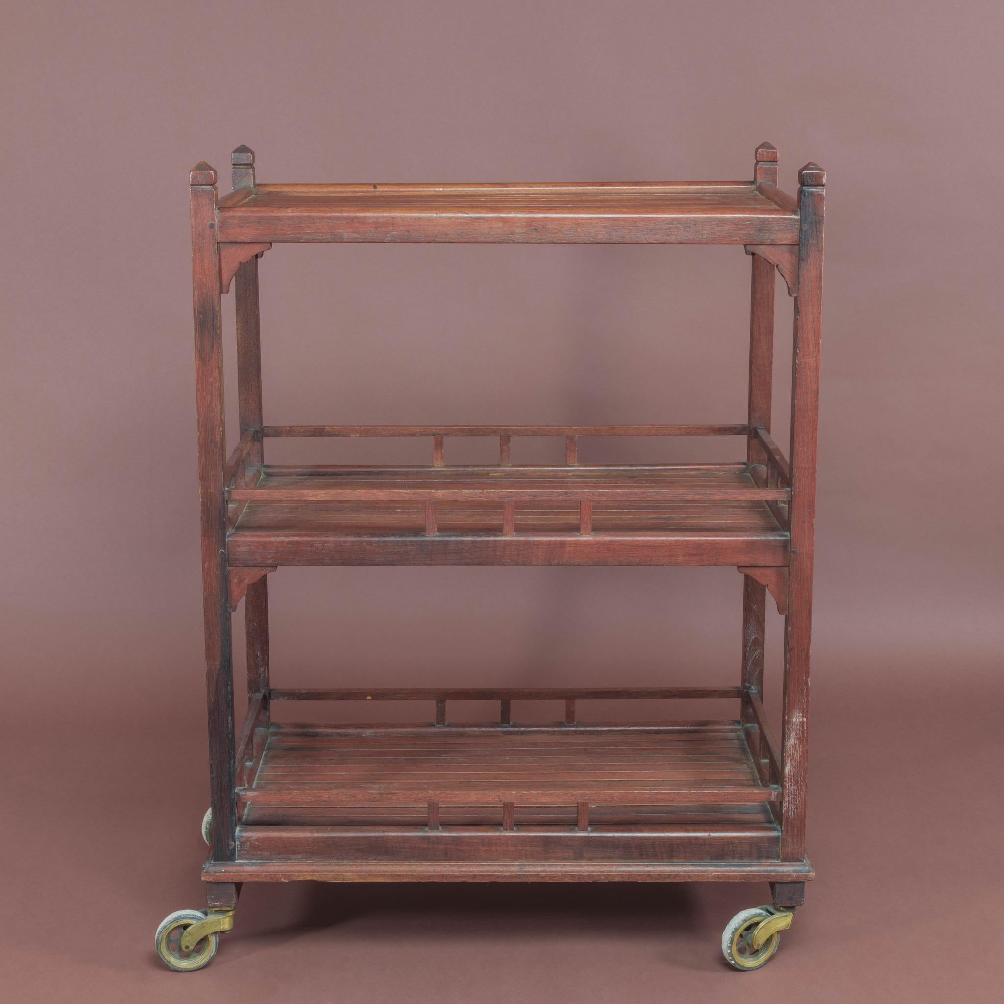 Wooden slatted garden trolley by Hughes, Bolckow & Co. Ltd. who were battleship breakers based at Battleship Wharf, Blyth, Northumberland. The company stripped the redundant ships and made furniture from the timbers of Britain’s old Battleships plus