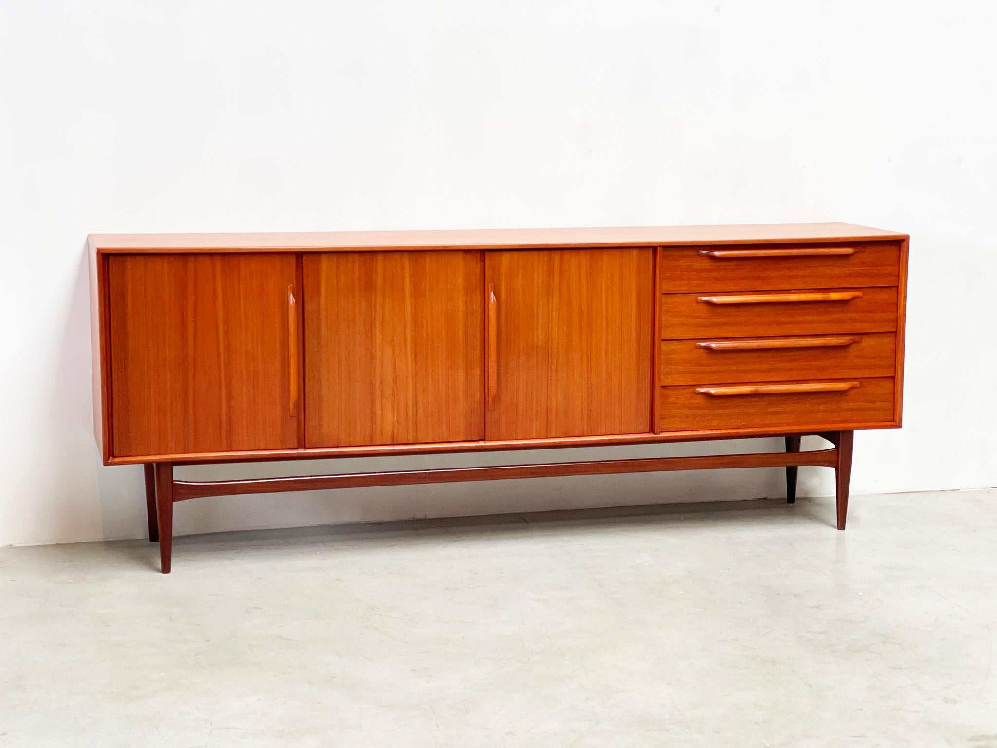 Elevate your space with the timeless elegance of the Teak Type 214 Sideboard by Heinrich Riestenpatt, manufactered by RT Möbel in 1960s Germany. Meticulously restored to perfection, this iconic piece seamlessly blends mid-century charm with modern