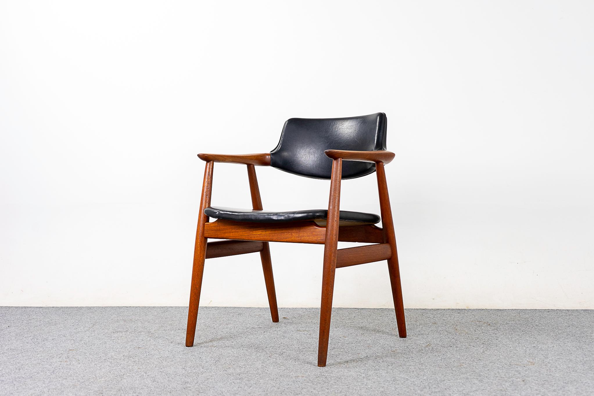 Teak and vinyl model GM11 armchair by Svend Aage Eriksen for Glostrup, circa 1960's. Beautifully sculpted elegant frame with swooping arms, perfectly scaled for any room!