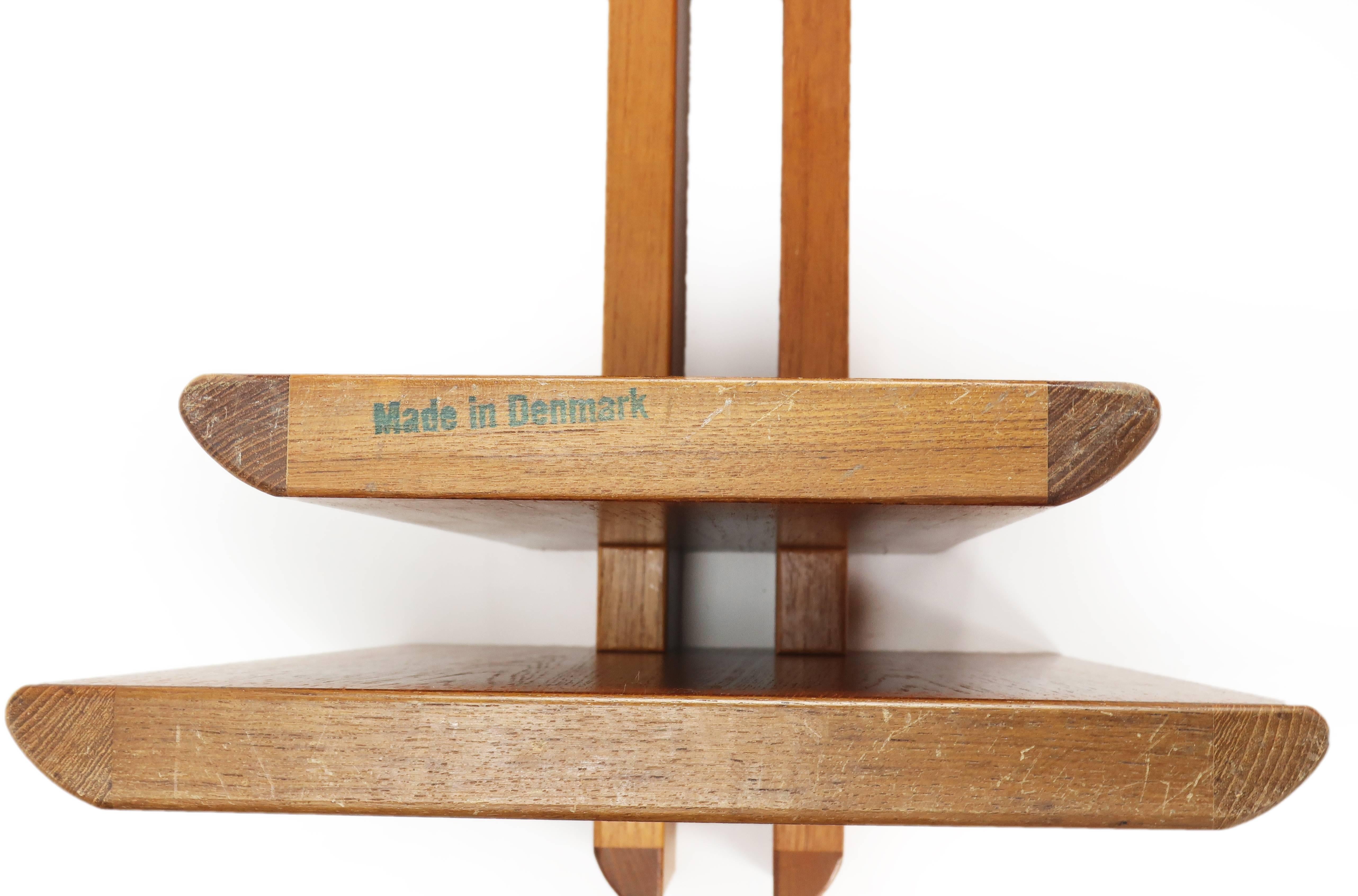 Danish Modern interlocking teak sculptural coffee table with beveled oval/rectangular glass top by Gustav Gaarde for Trakanten. Table is marked “Made in Denmark”.