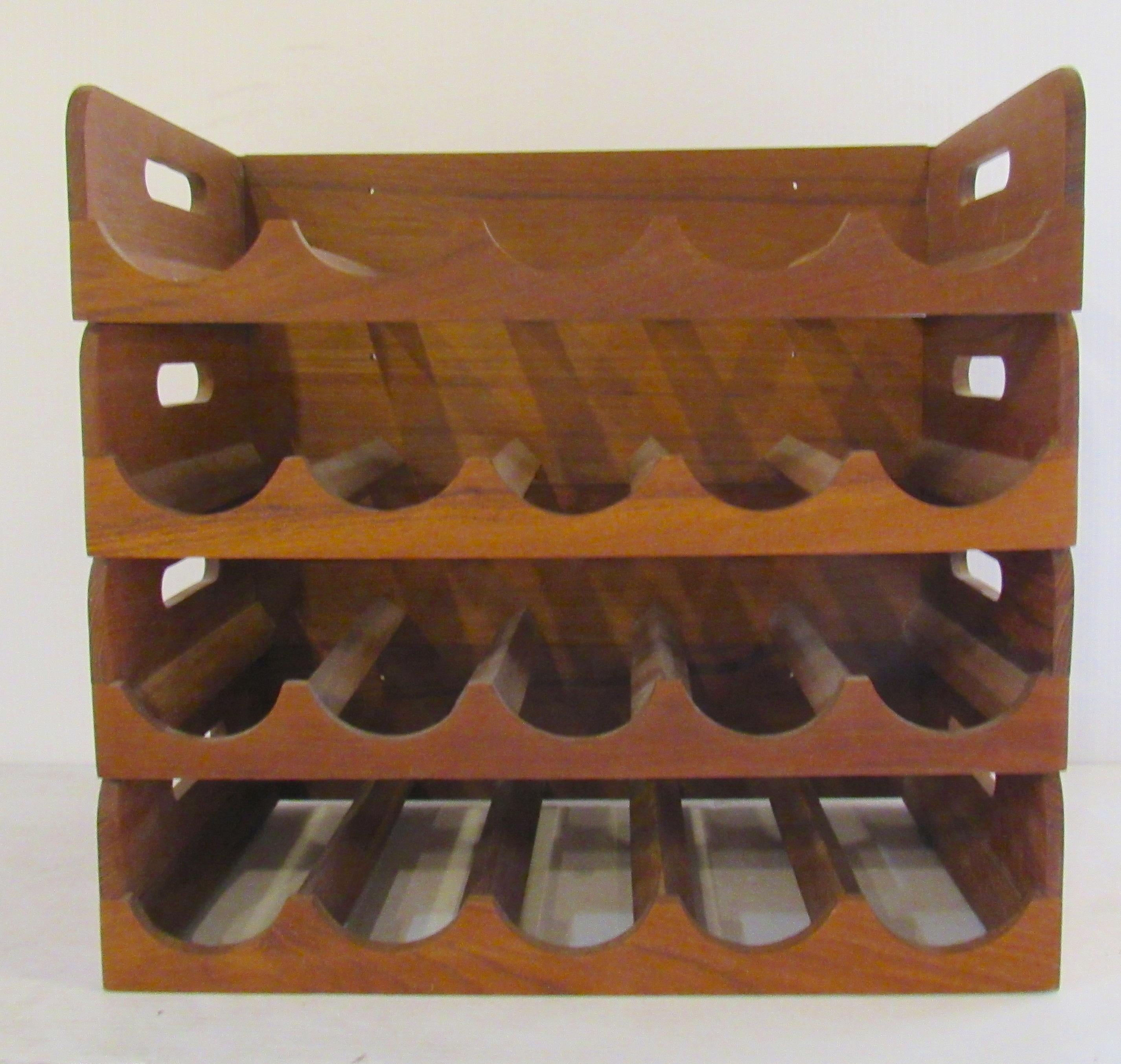 Set of four teak wine racks by Kalmar. Made for table top or to be hung.
(Please confirm item location - NY or NJ - with dealer).
 