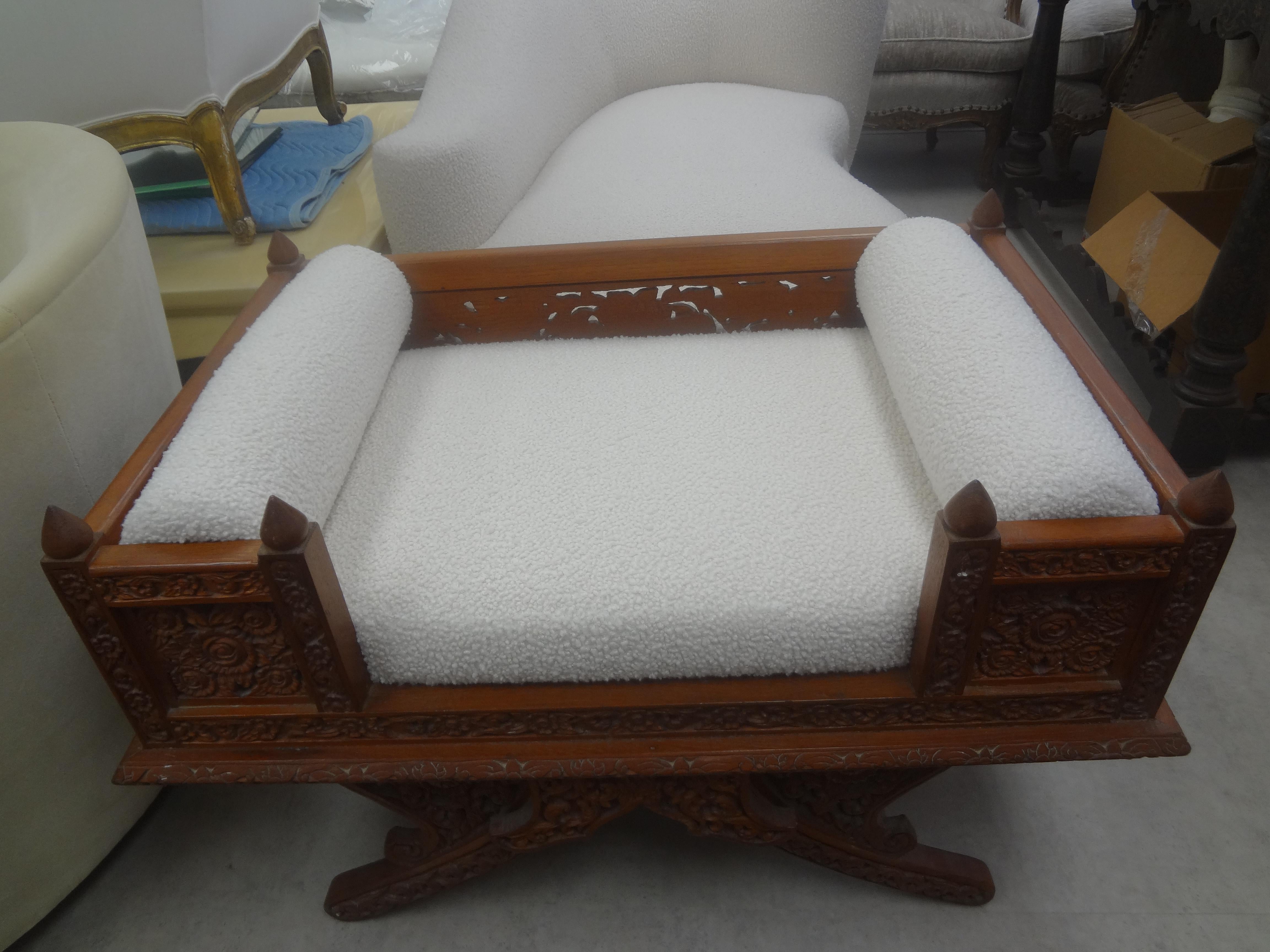 Teak Howdah Elephant Saddle Chair.
Beautifully carved Asian teakwood Howdah elephant saddle chair or bench, Thailand, 1920.
This unusual Anglo-Indian chair or bench has been newly upholstered in cream boucle fabric with a cushion and two side