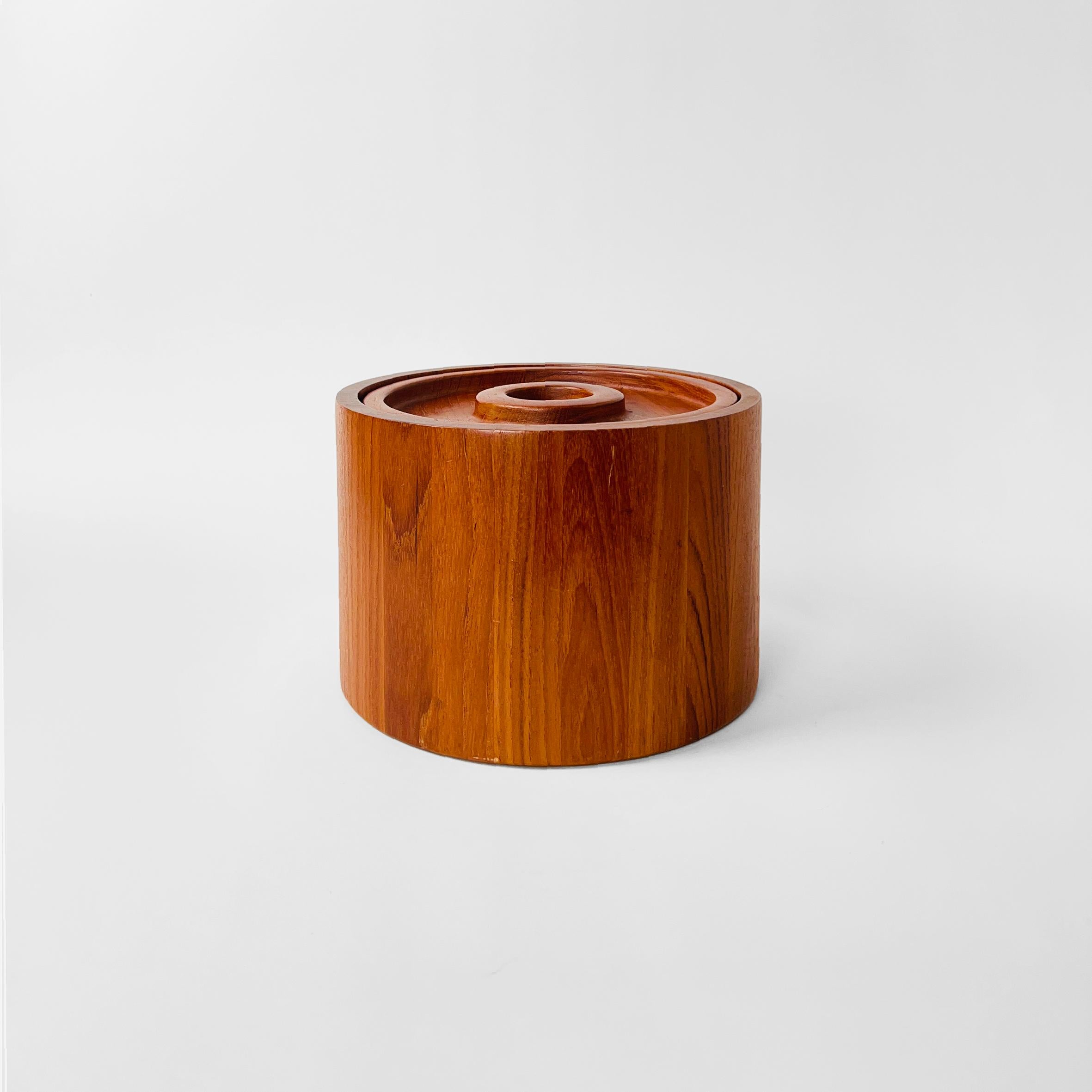 Teak ice bucket made of staved teak with an black plastic liner. Designed by Jens Quistgaard, a Danish sculptor and industrial designer, in the late 1970s for Dansk Designs.