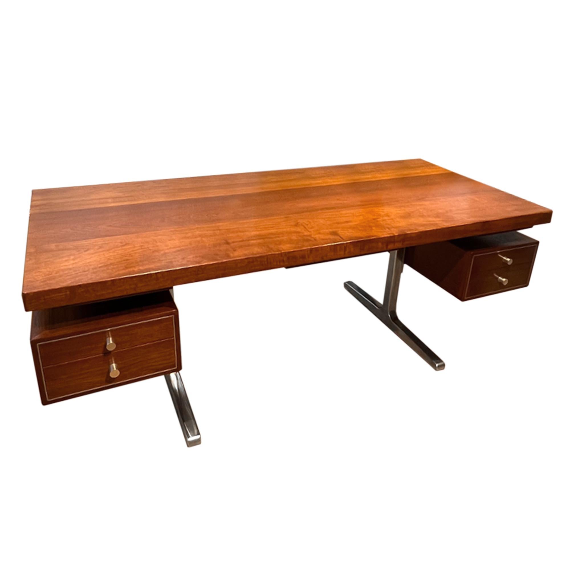 This fantastic desk was made in Italy in the 1960s.

An elegant midcentury design with polished metal detail on the legs, drawers and handles.

A great addition to your home office or a reception desk in a hotel. 

Leg clearance is 67.5cm.