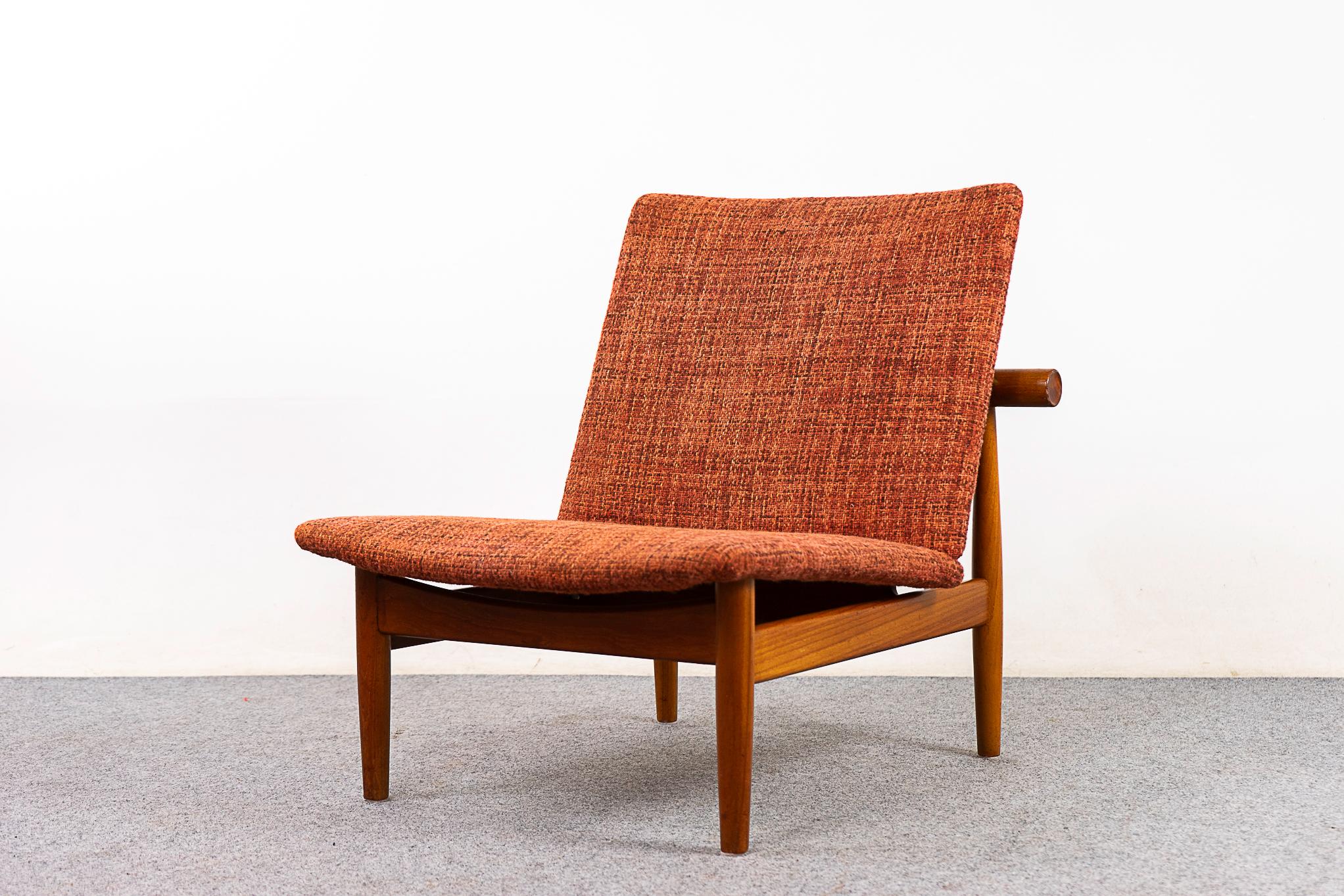 Teak Japan chair by Finn Juhl for France & Son, 1957. Simple, elegant frame inspired by Japanese temple doors. Tapered legs, brass hardware and horizontal back rest with recessed circular ends. France & Son makers mark intact.