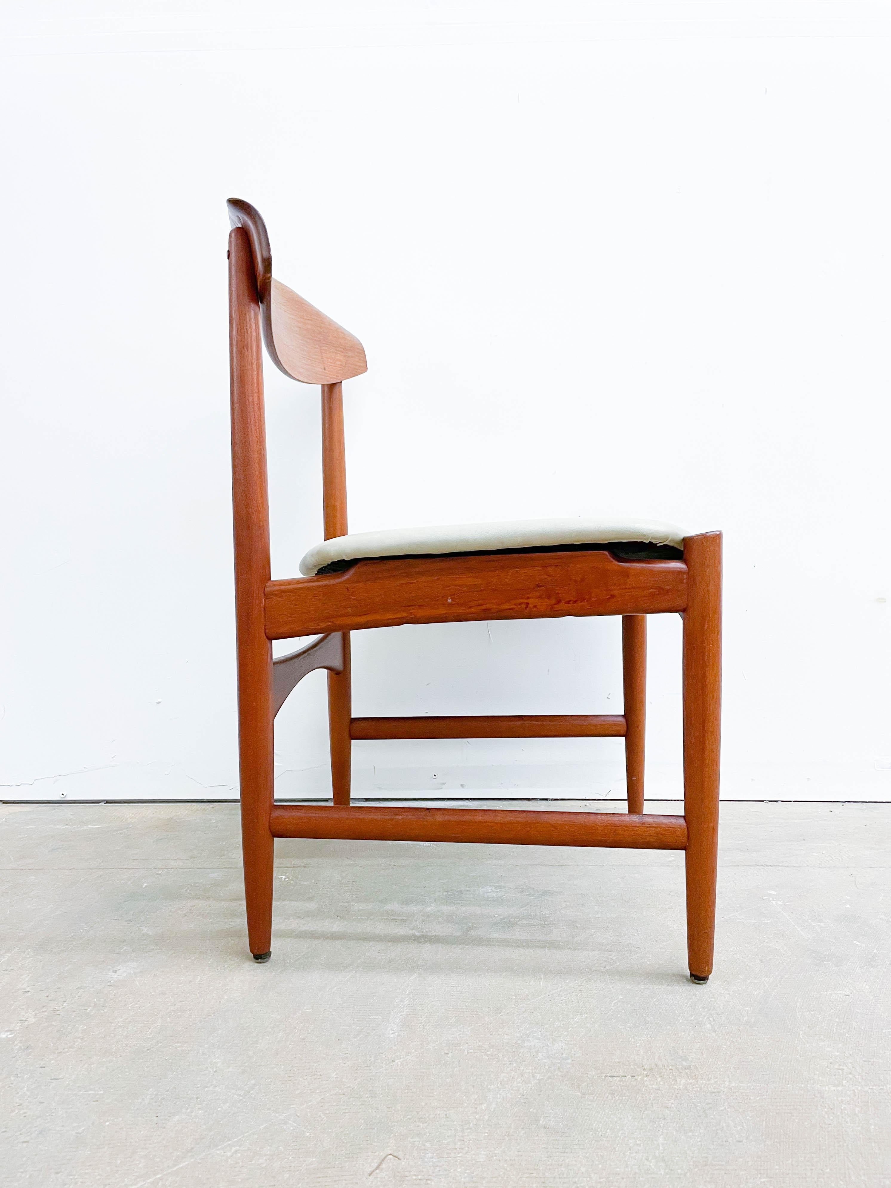 This is a rare example of a teak side chair with a bent wood back designed by Kofod Larsen and made and distributed by Selig. This is a stunning chair from the 1950s that is the epitome of Danish mid-century modern design.  The teak used is