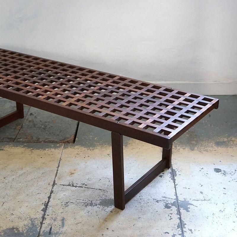 Danish Mid Century low table. Exquisitely made from solid teak with joined seamlessly sections forming the lattice top and Lovig Nielsen’s signature trapezoid legs. It is in excellent vintage condition, there is a small amount of wear and tear as