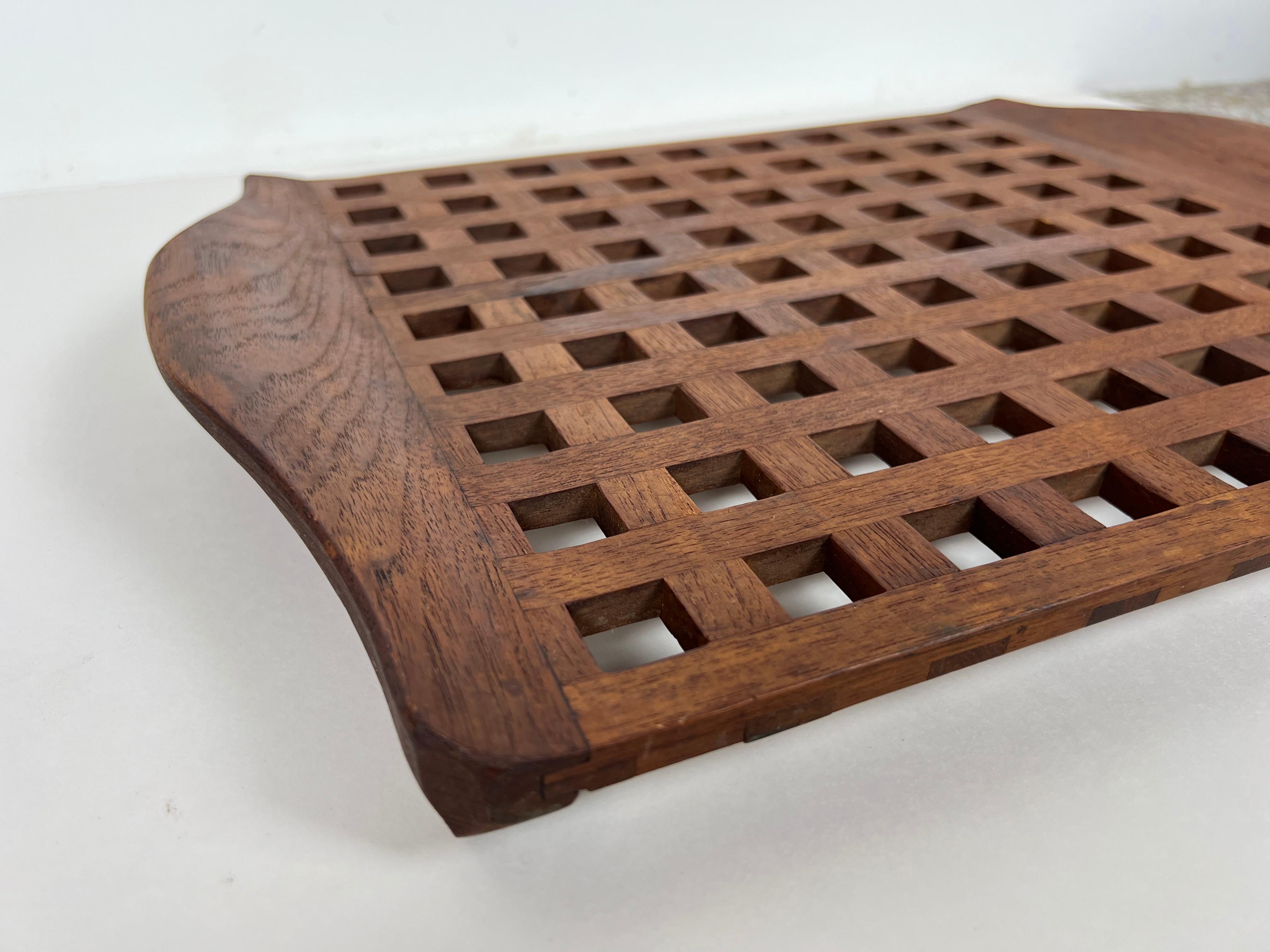 Vintage teak lattice serving tray with sculpted handles designed by Jens Quistgaard for Dansk. There are two versions of this tray, this iteration is the older and more uncommon of the two. Stamped 'Denmark JHQ' to underside. 

Designer: Jens