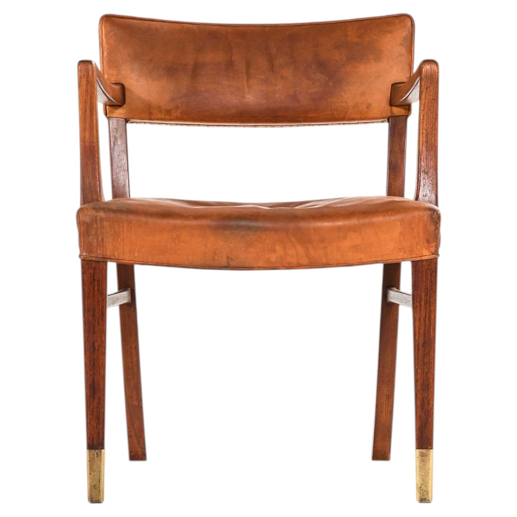 Poltrona in teak, pelle e ottone attribuita a Ernst Kühn, anni '40