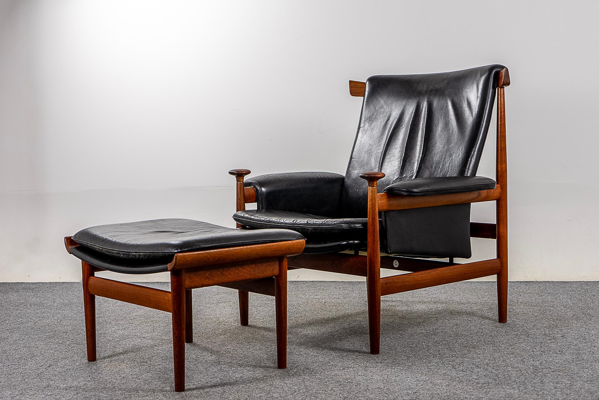 Teak and leather Bwana Model 152 lounge chair + footstool by Finn Juhl for France & Son, circa 1960's. Iconic lounger features a striking curved design with floating seat and distinctive pommel handrests. Generous proportions and ergonomic angles