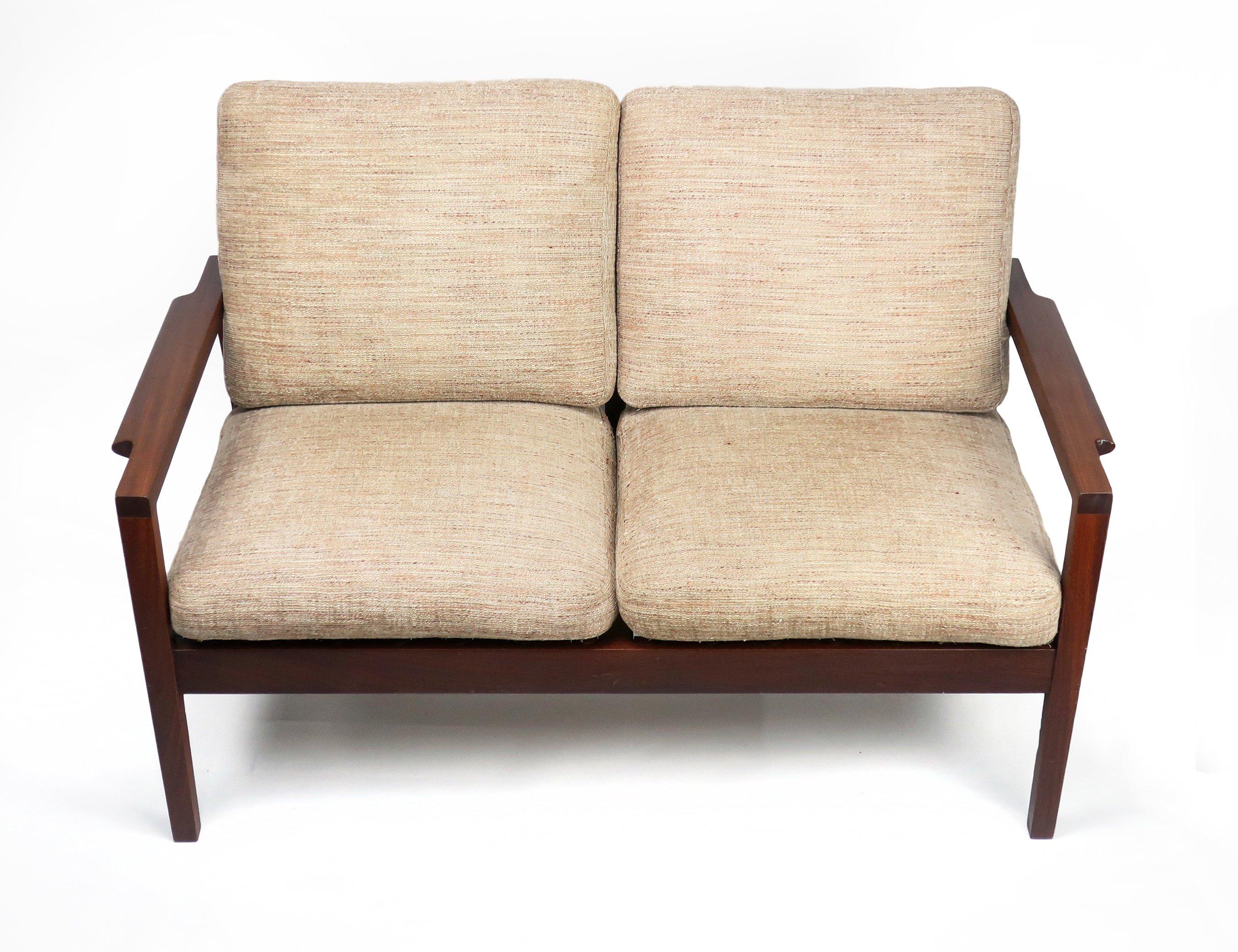 A lovely two seat teak couch by Canadian modern furniture maker RS Associates of Montreal. Frame is the rich reddish brown of midcentury teak furniture and the soft tan upholstery has traces of brown, red and green and sits on rubberized metal seat