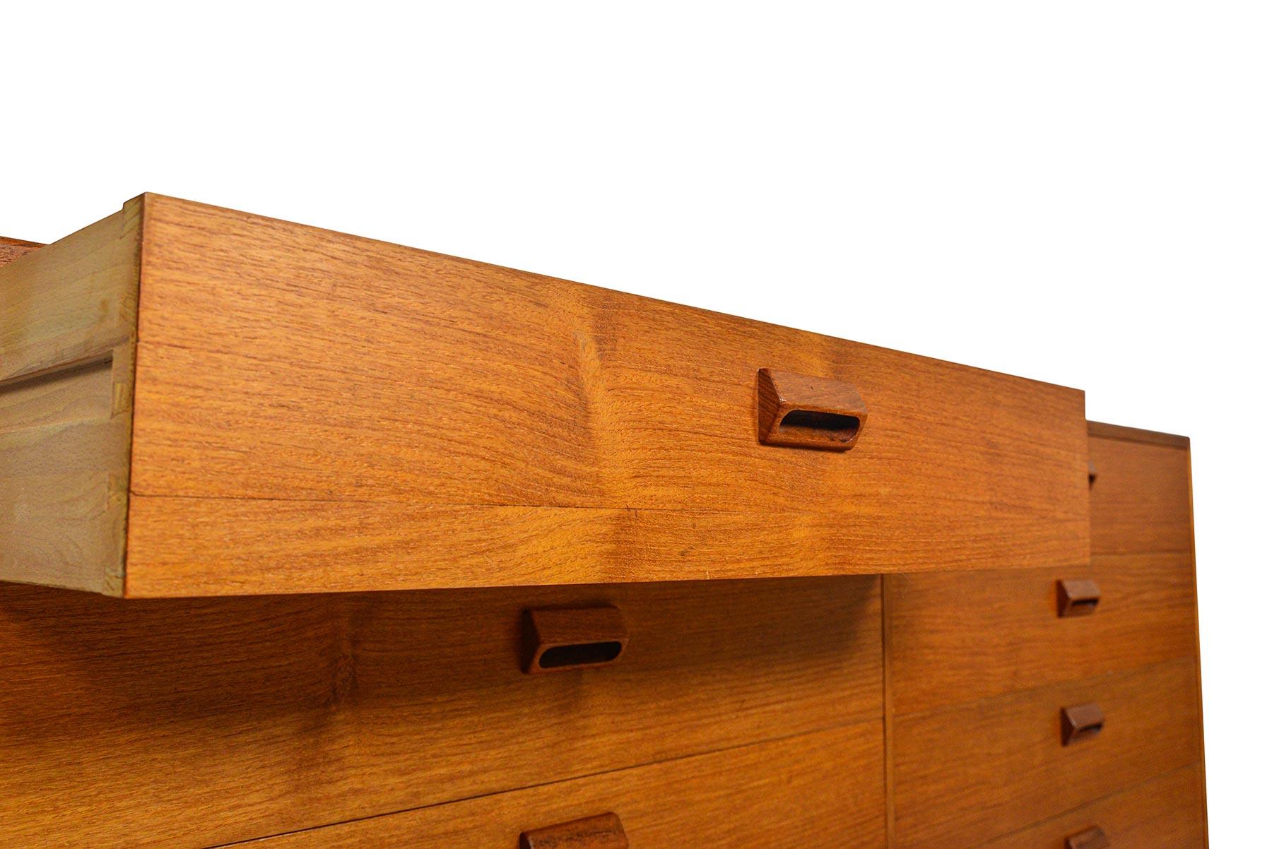 This beautiful low double dresser was designed by Børge Mogensen for Søborg Møbelfabrik in the 1950s. The case is expertly crafted in teak and stands on a solid teak base. Each drawer front is adorned with the designer’s signature handle. Eight deep
