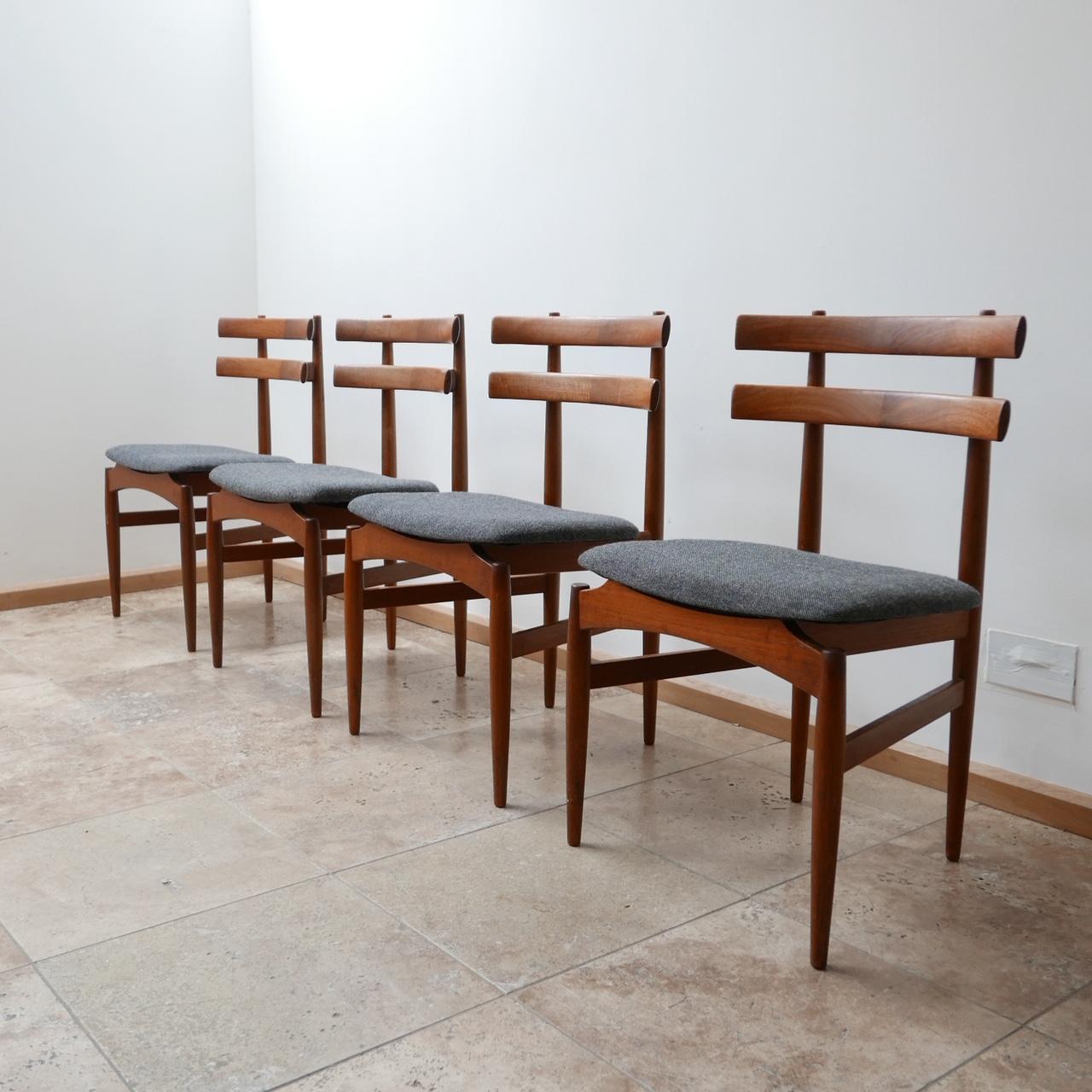 Immensely stylish set of four dining chairs by Poul Hundevad.

Teak, with upholstered seats in perfect condition.

Model 30 for Hundevad & Co.

Denmark, circa 1950s.

Dimensions: 49 W x 44 D x 44.5 seat height x 78 total height in cm.


  