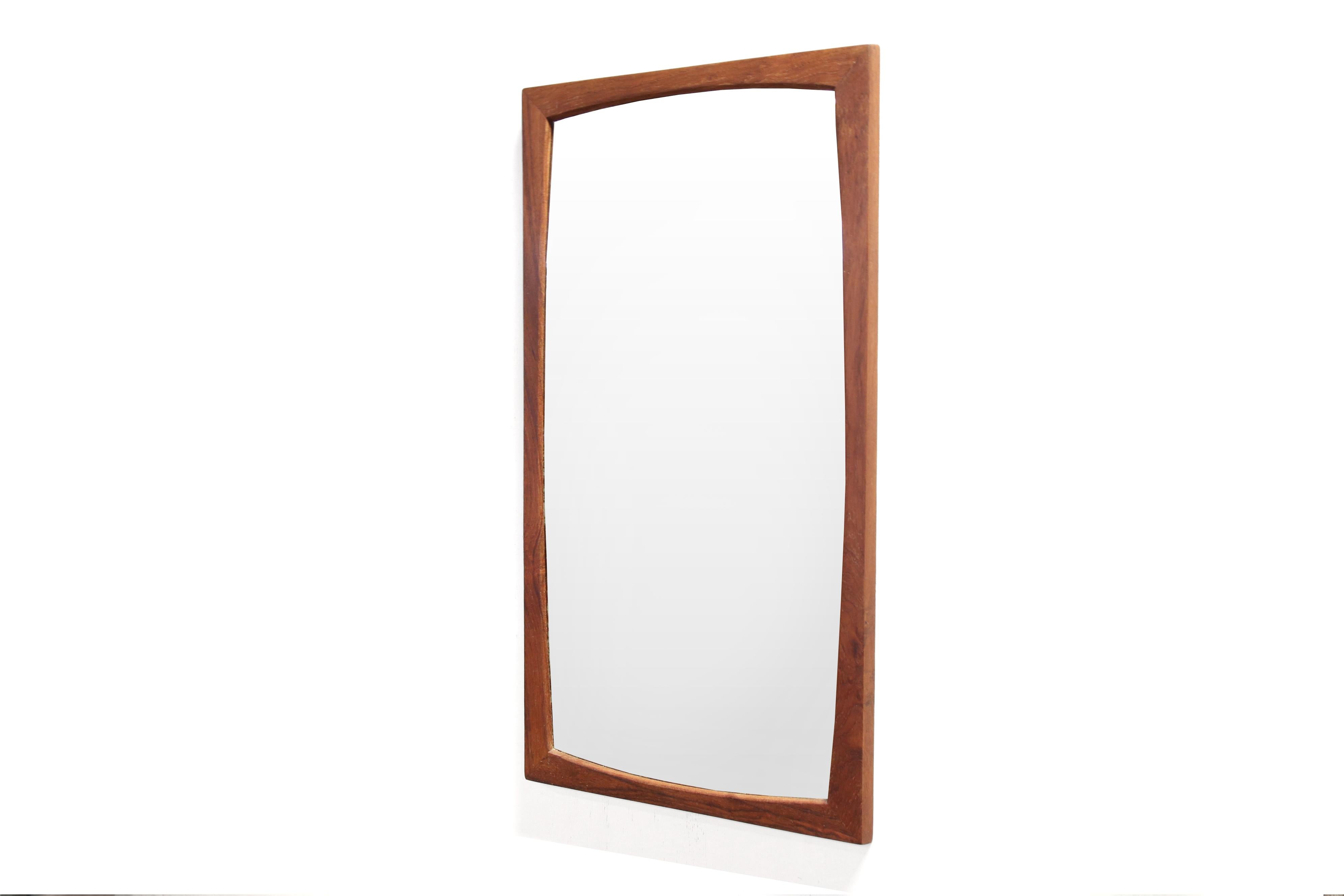 Very beautiful teak mirror designed by Kai Kristiansen and produced by Aksel Kjersgaard in Odder Denmark. It is often mistakenly thought that Aksel Kjersgaard is the designer of these mirrors, but Aksel Kjersgaard is mainly a producer who has, among