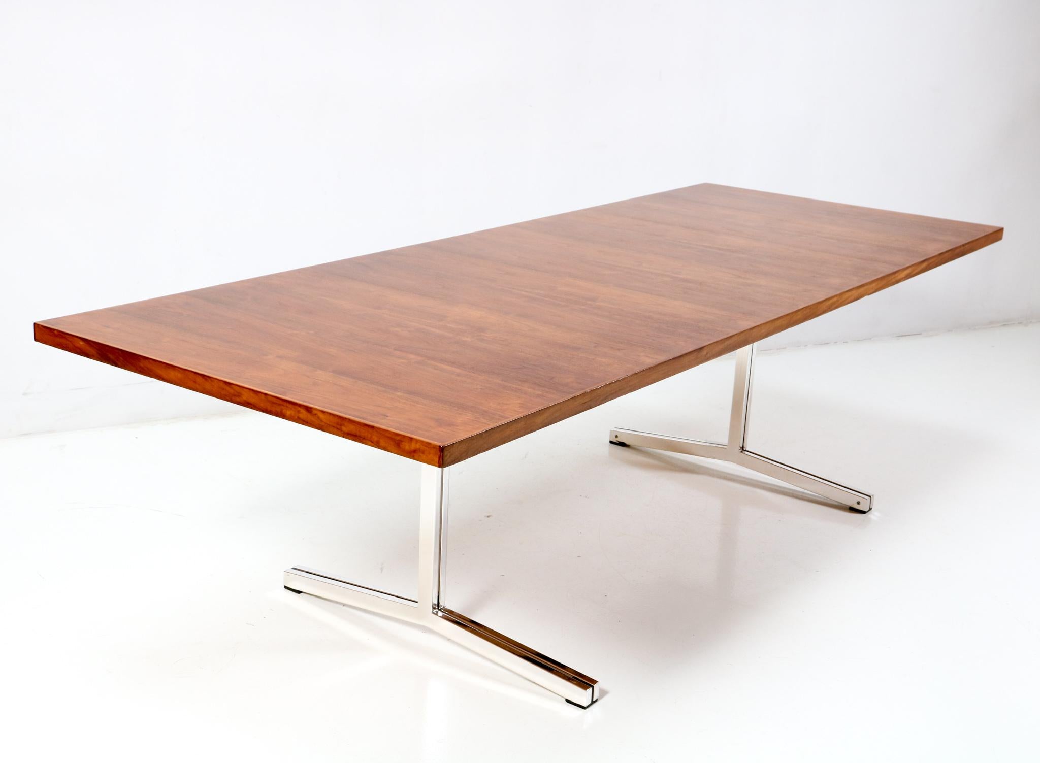 Magnificent and large Mid-Century Modern conference table or dining room table.
Design by Theo Tempelman for AP Originals.
Striking Dutch design from the 1960s.
Original re-chromed plated metal frame with original teak veneered top.
This wonderful