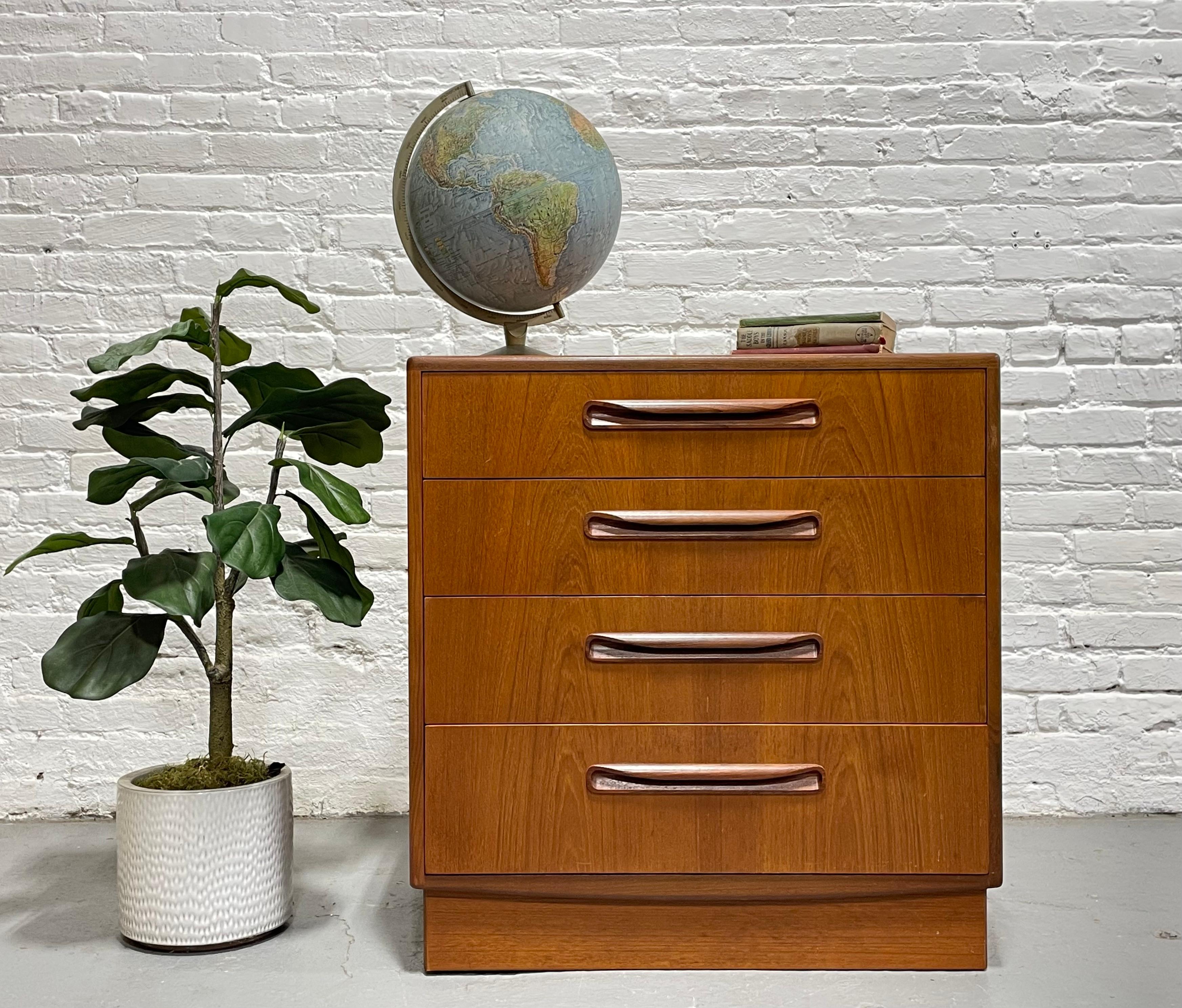 Vintage Mid century Modern Teak Dresser from G-Plan's iconic Fresco line, c. 1960's.  This small piece packs a punch offering 4 wide and spacious dovetailed drawers. The warm, rich tones of the teak wood are beautifully highlighted by the unit’s