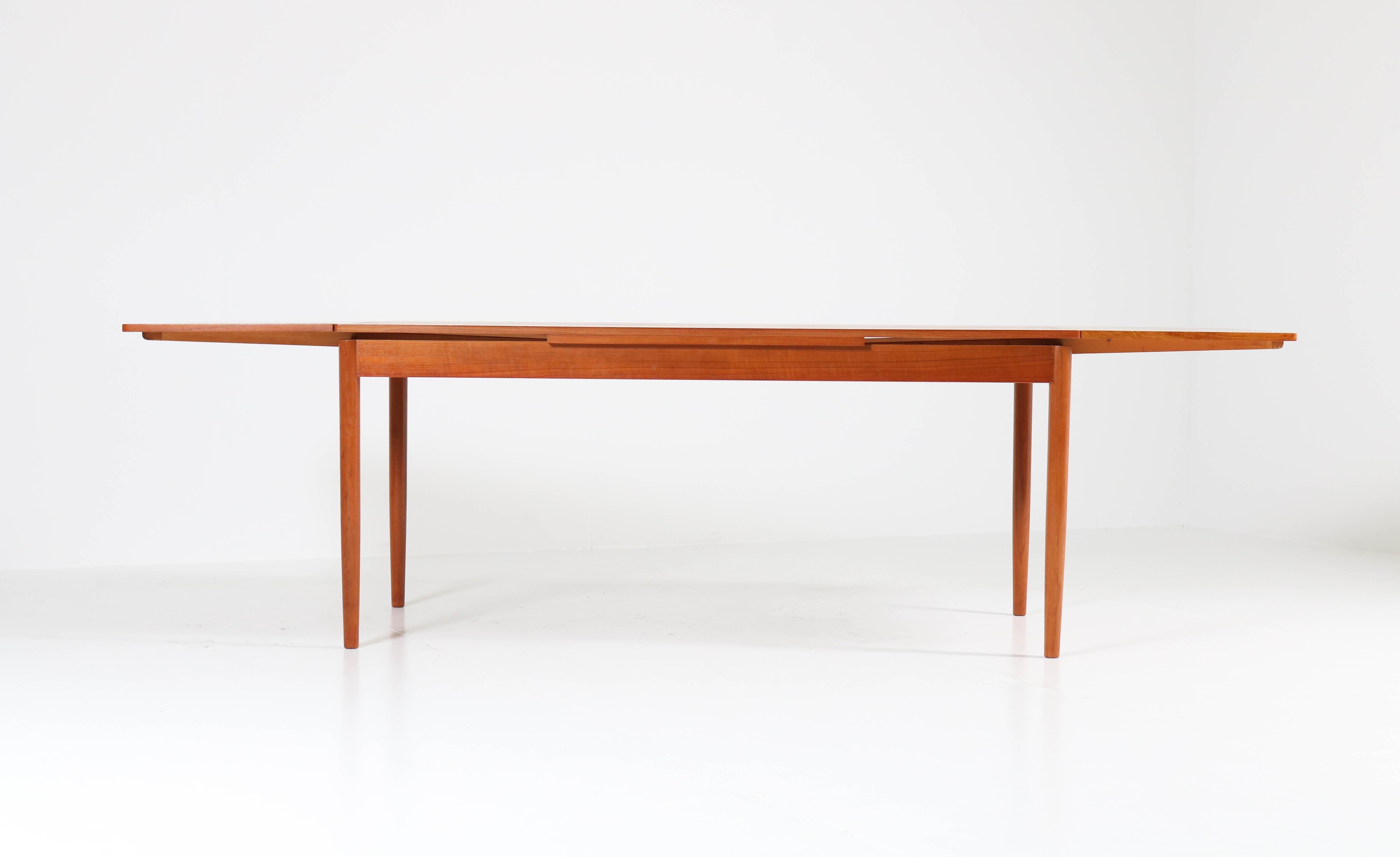 Funky Mid-Century Modern extendable table.
Striking Dutch design from the sixties.
Solid teak legs with teak veneered tops.
Table can be dismantled into five pieces for safe transport.
In good original condition with minor wear consistent with