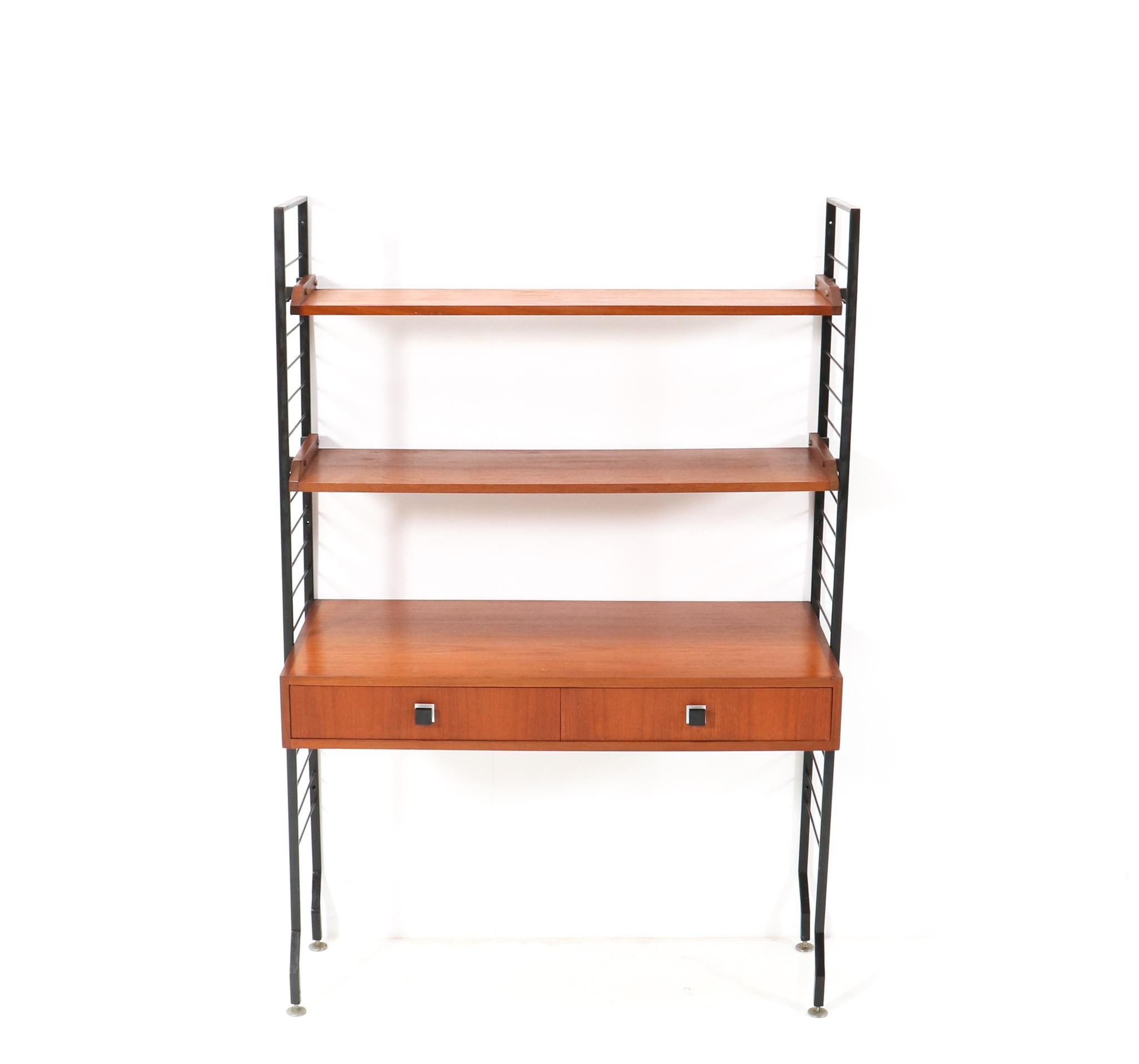 Magnificent and rare Mid-Century Modern freestanding shelving unit.
Striking Belgium design from the 1960s.
This wonderful Mid-Century Modern freestanding shelving unit consists of
Two original black lacquered iron uprights.
Two original teak