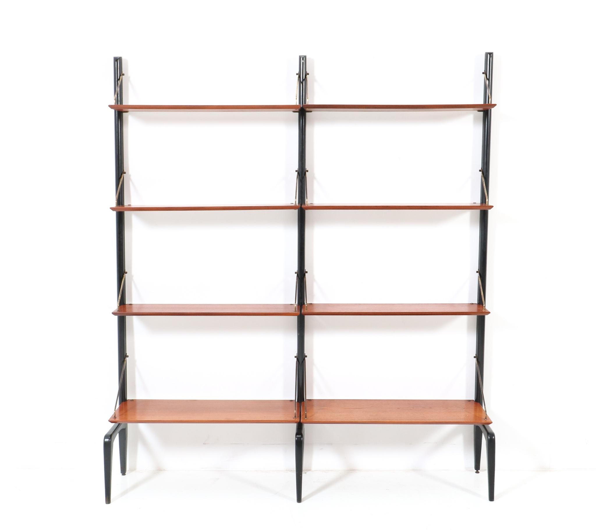Stunning and rare Mid-Century Modern free standing wall unit.
Design by Louis van Teeffelen for WéBé.
Striking Dutch design from the 1950s.
This wonderful Mid-Century Modern wall unit by Louis van Teeffelen for WéBé consists of:
Three original