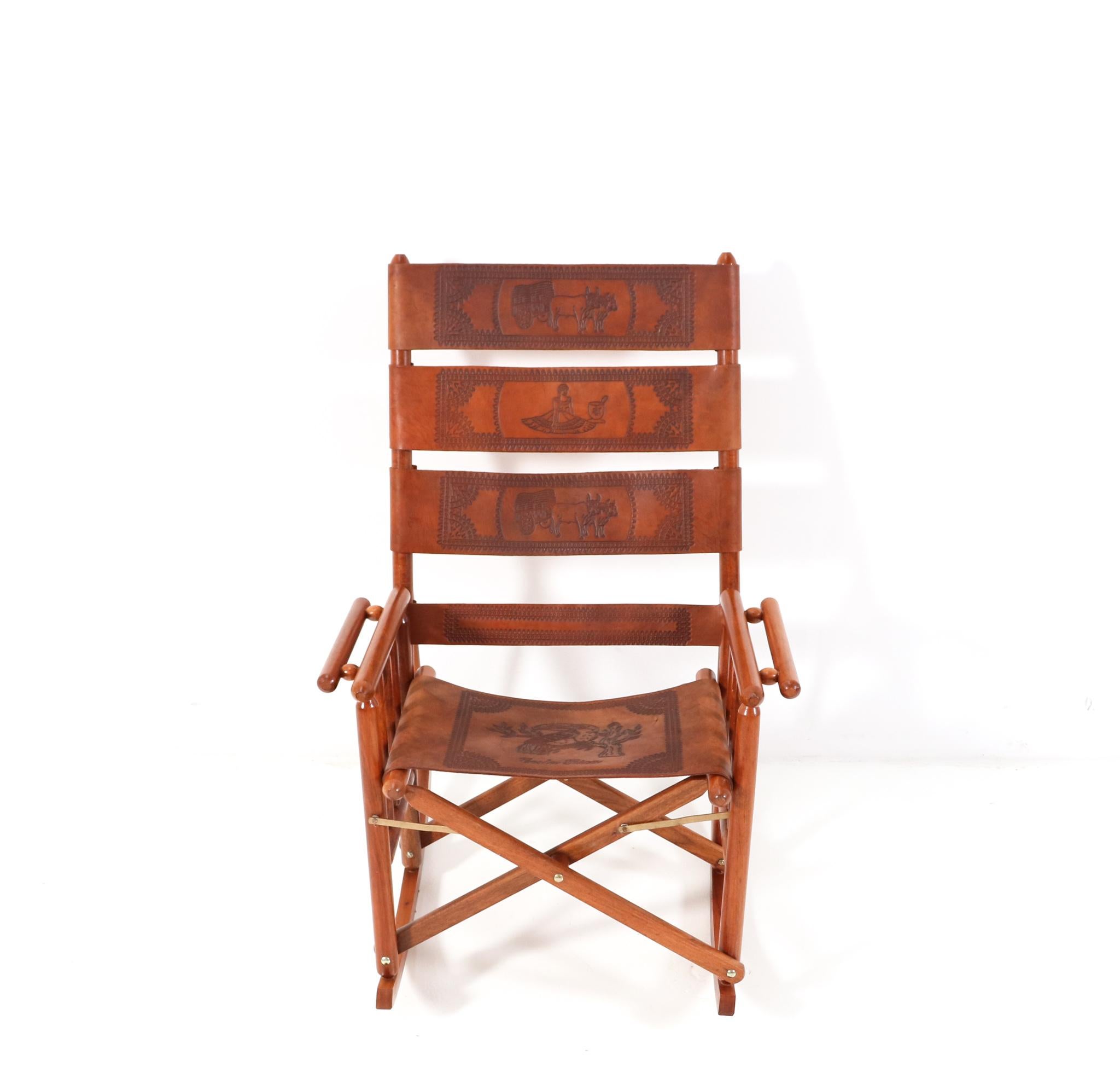 Magnificent and rare Mid-Century Modern campaign rocking chair.
Striking Costa Rican design from the 1970s.
This wonderful Mid-Century Modern rocking chair has a sleek teak cylindrical
frame with unique spindle sides and double wide