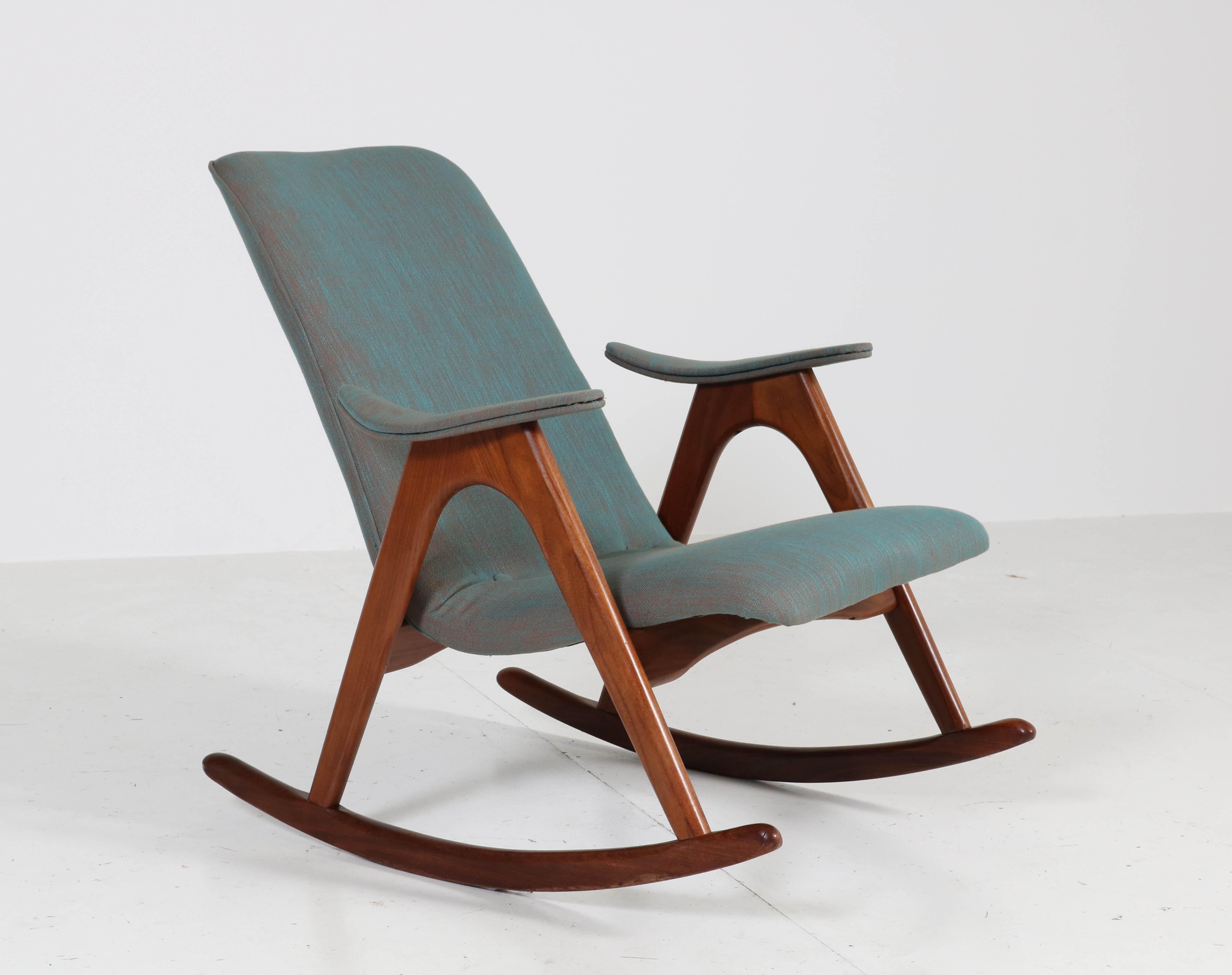 Wonderful Mid-Century Modern rocking chair.
Design by Louis Van Teeffelen for Webe.
Striking Dutch design from the 1960s.
Solid teak frame and re-upholstered with quality Italian fabric.
In very good condition with minor wear consistent with age