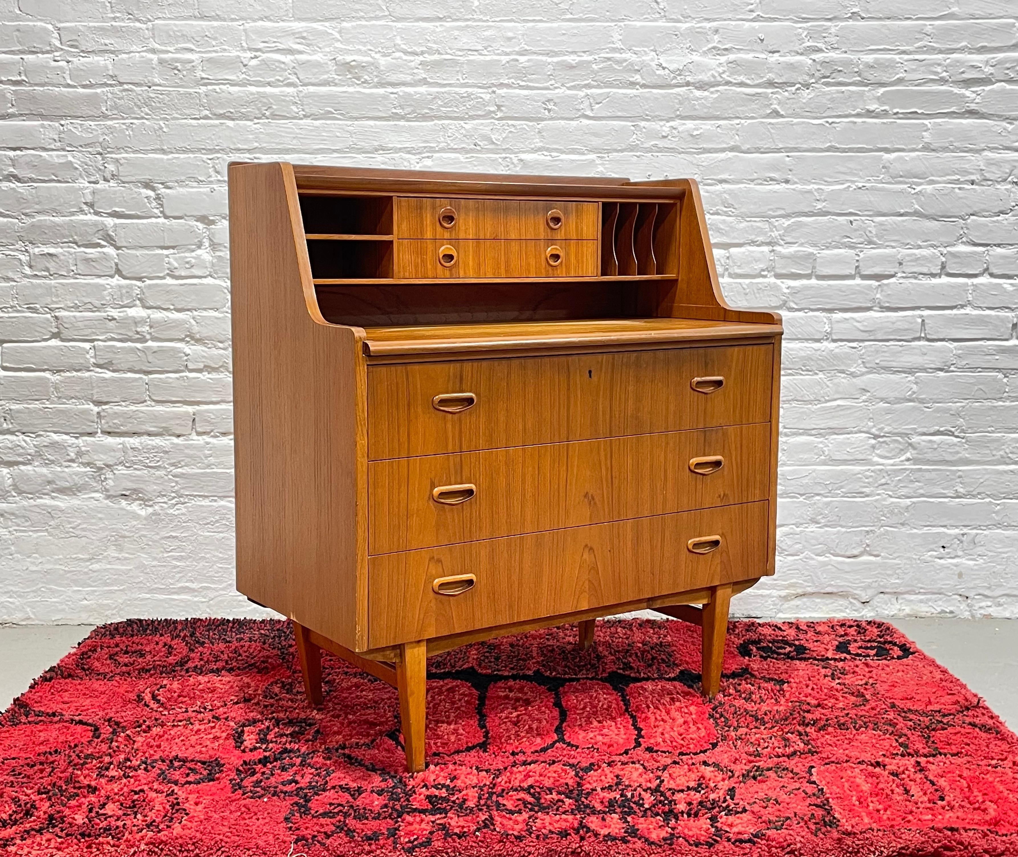 Vintage Mid century Modern Teak Secretary desk + dresser by Egon Ostergaard for SMI Svenk, Made in Sweden, c. 1960's. This piece boasts tons of delicious design details: three deep and spacious drawers below and a pull out desk, plus additional