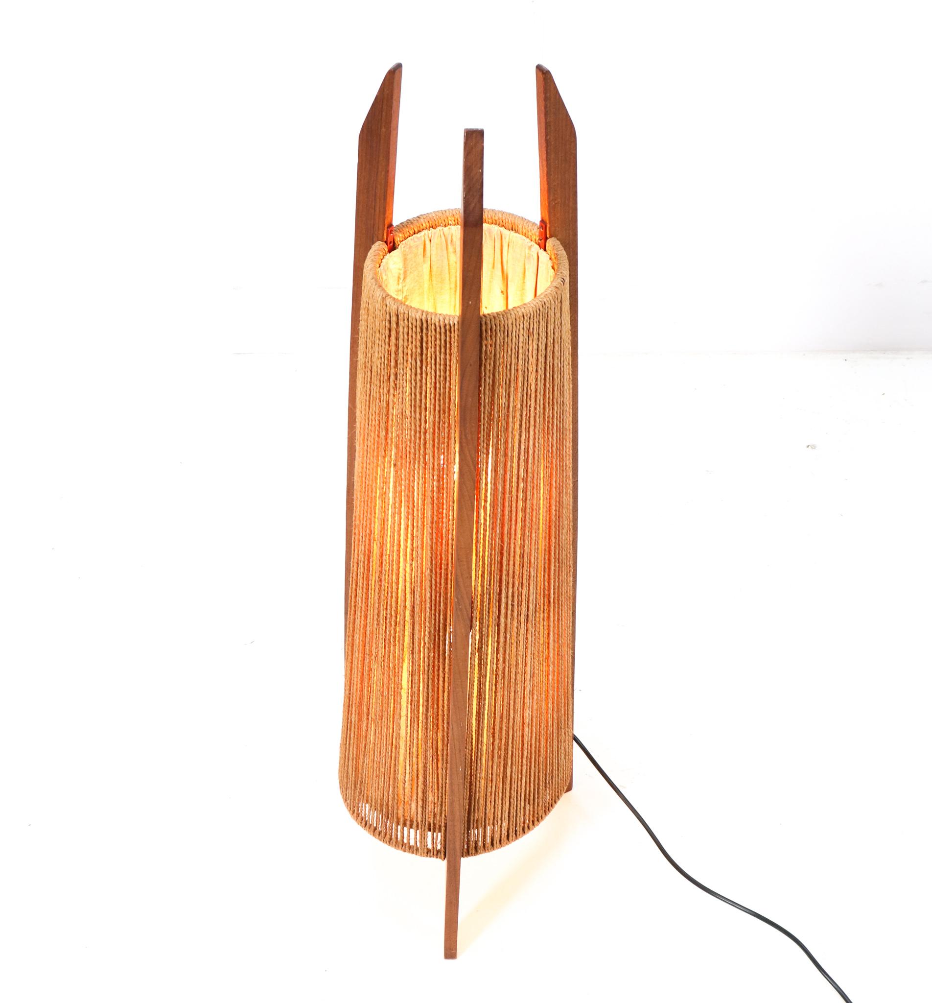 Amazing and rare Mid-Century Modern floor lamp.
Striking Danish design from the 1960s.
Solid teak frame with original hemp strings to reflect the light bulbs.
This wonderful Mid-Century Modern floor lamp will be a real eye-catcher in a