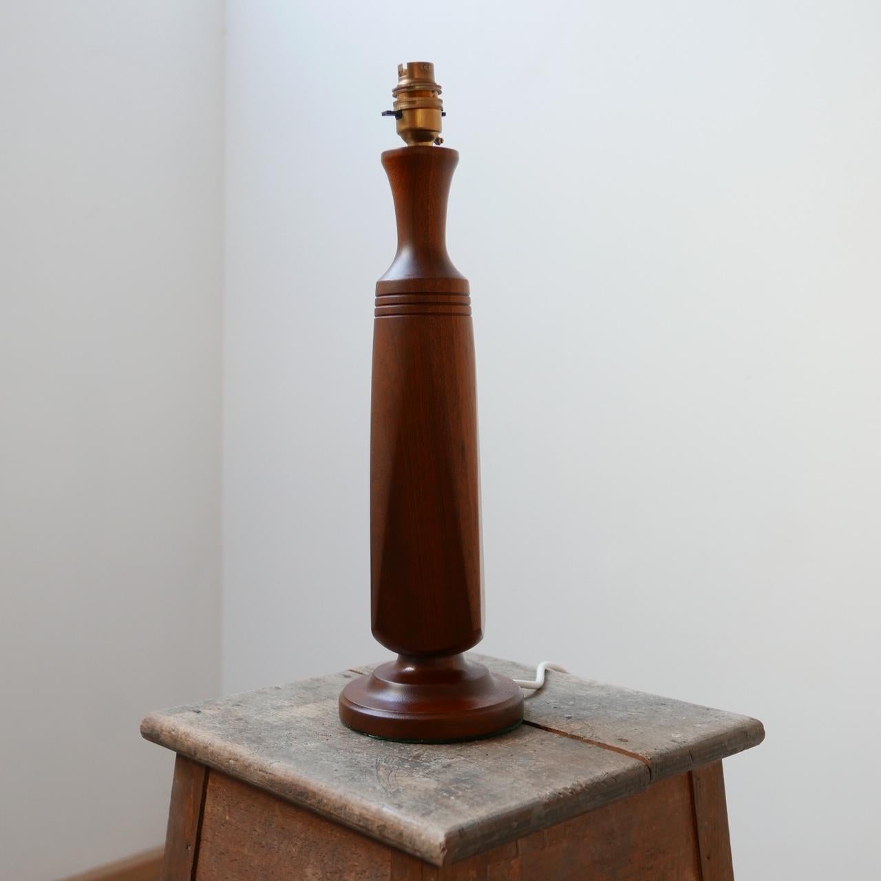 An elegant midcentury teak table lamp.

Likely Danish, circa 1960s.

Simple elegant turned wood.

Re-wired and PAT tested.

Dimensions: 46 height x 12 diameter in cm.