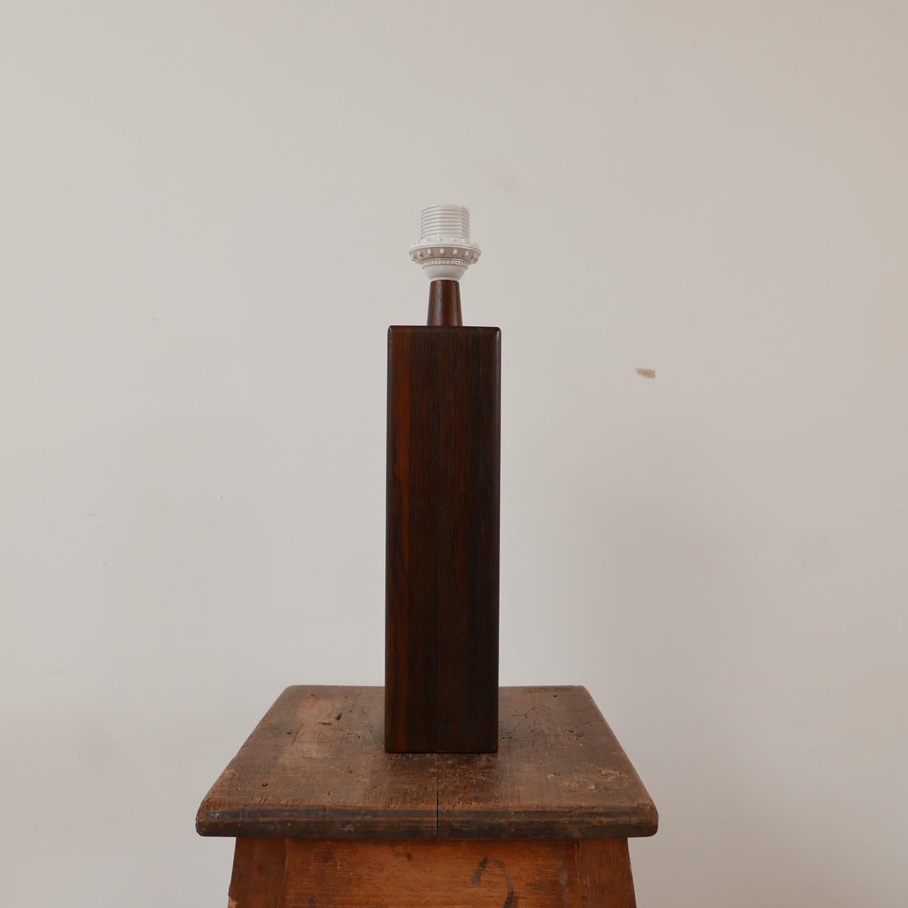A simple elegant solid teak mid-century table lamp. 

Sweden, c1960s. 

Since re-wired and PAT Tested. 

Dimensions: 42 H x 10 D x 10 W in cm. 

Delivery: POA.

