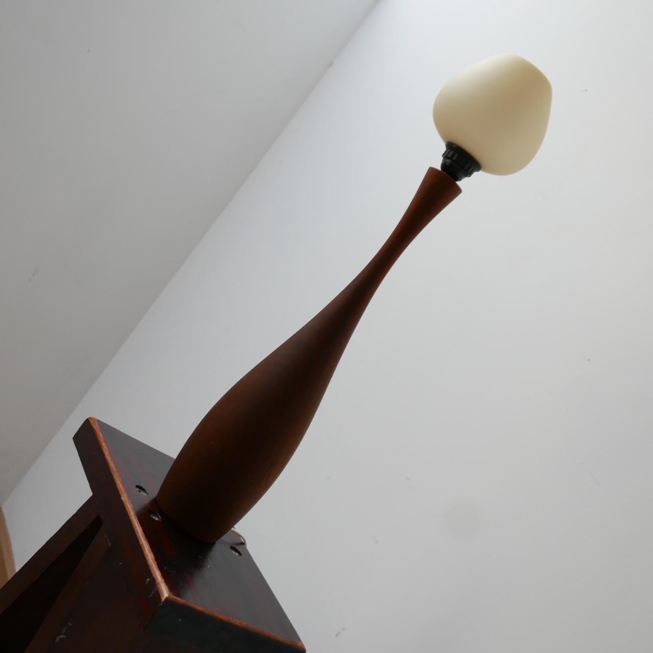 A tall table lamp. 

Teak with a glass shade. 

Sweden, c1960s. 

Since re-wired and PAT tested.

Location: London Gallery. 

Dimensions: 71 H x 13 Diameter. 60 H without shade in cm. 

Delivery: POA

We can ship around the world. Can
