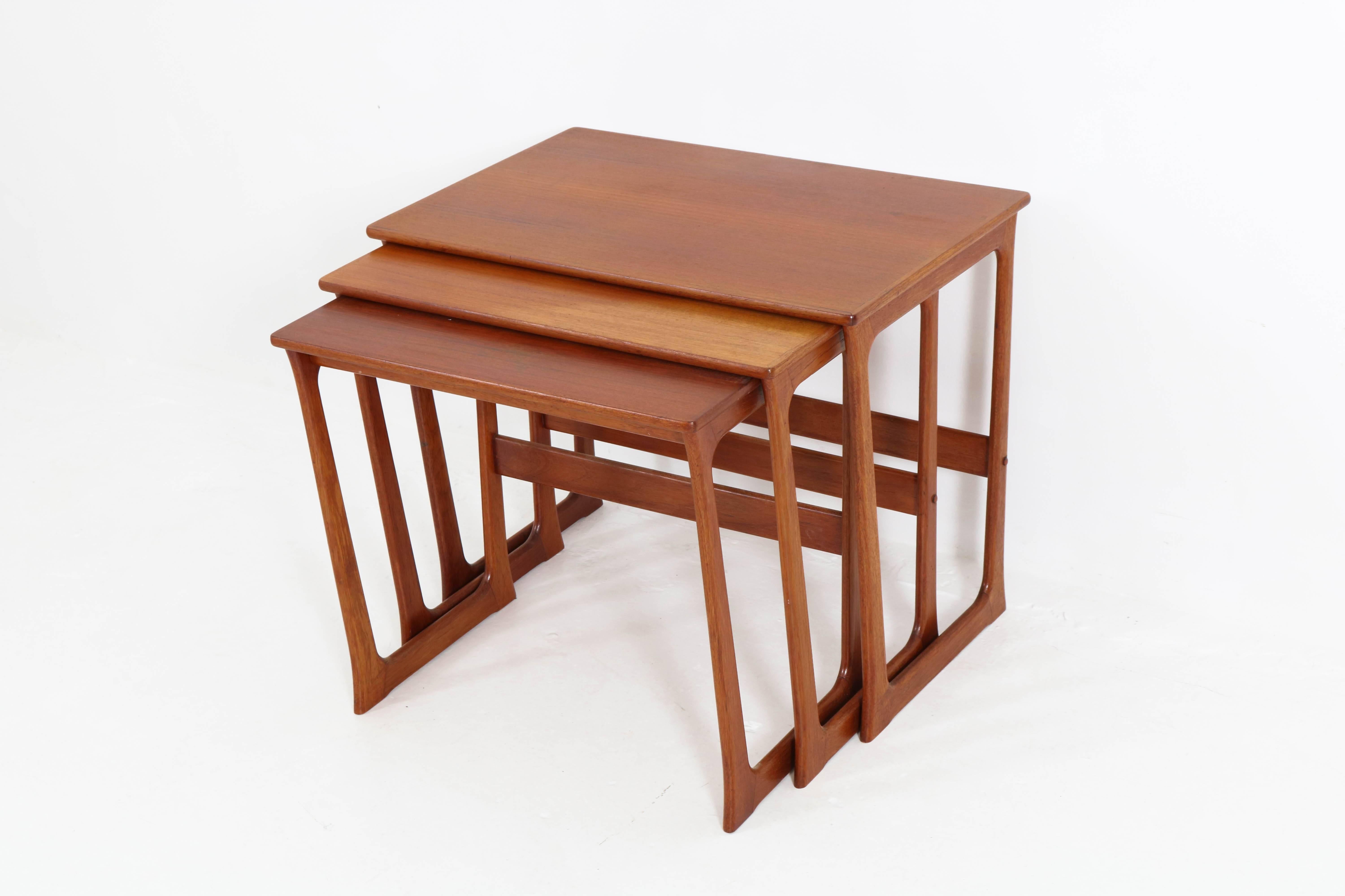 Nice set of Danish Mid-Century Modern nesting tables by Johannes Andersen, 1960s.
Solid teak.
Marked: Made in Denmark.
In good original condition with minor wear consistent with age and use,
preserving a beautiful patina.