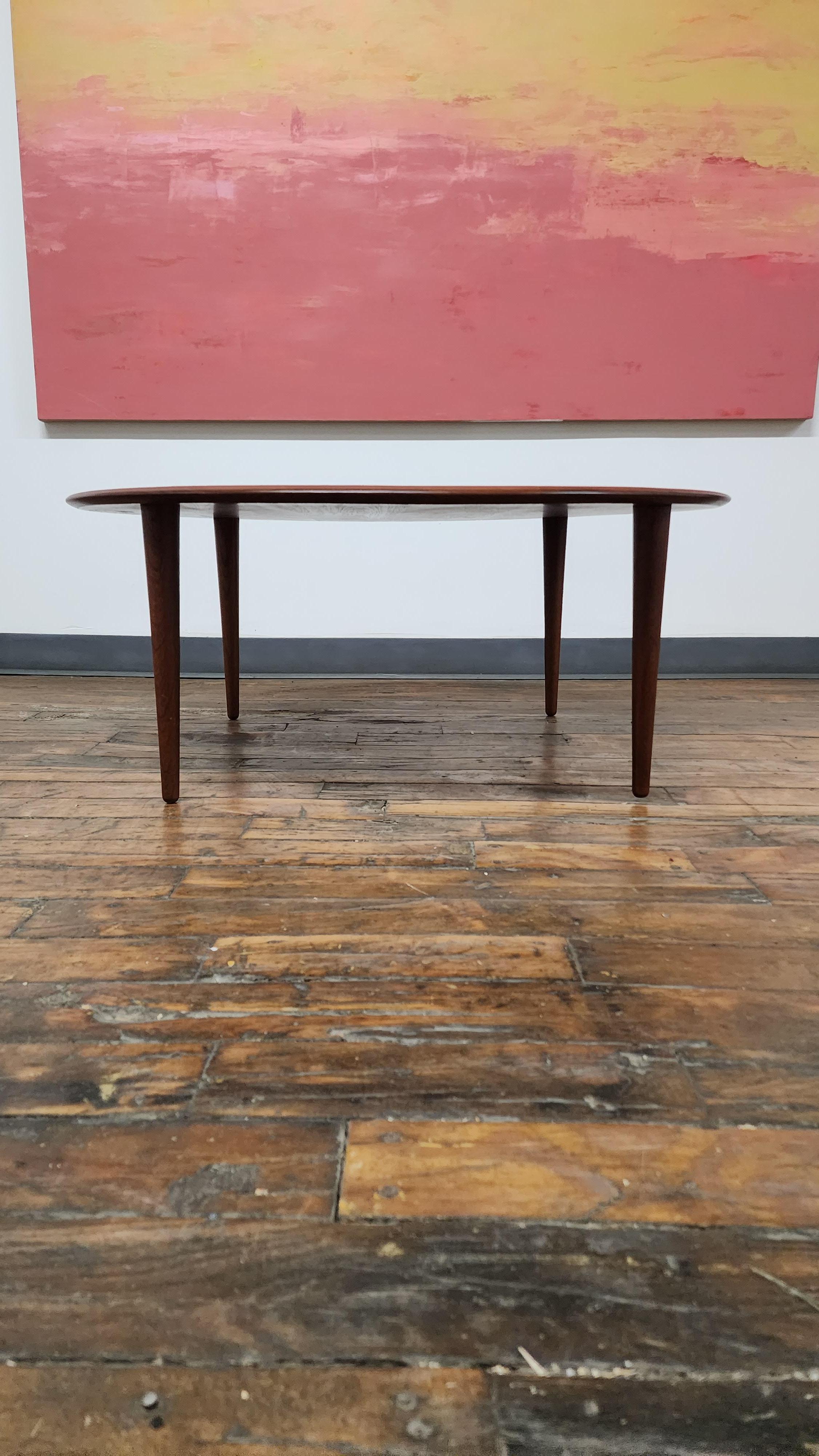 Beautiful solid teak coffee table from the Minerva line by Peter Hvidt and Orla Mølgaard-Nielsen.   