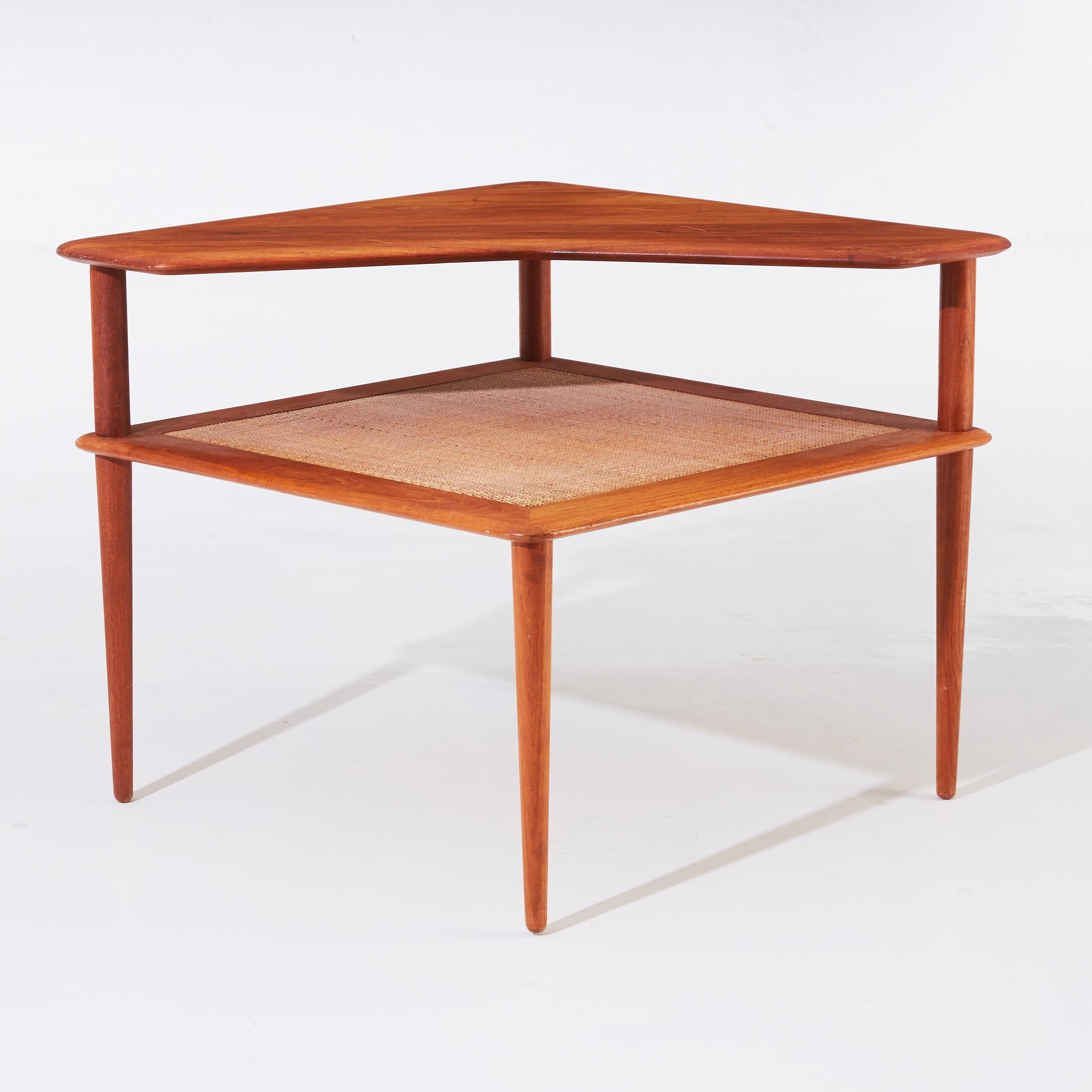 Coffee table by Danish designer duo Peter Hvidt & Orla Molgaard-Nielsen for the Manufacture France & Son in the 1960s. It is made of solid teak, the undertier in weaved bamboo.
With manufacture's seal.
