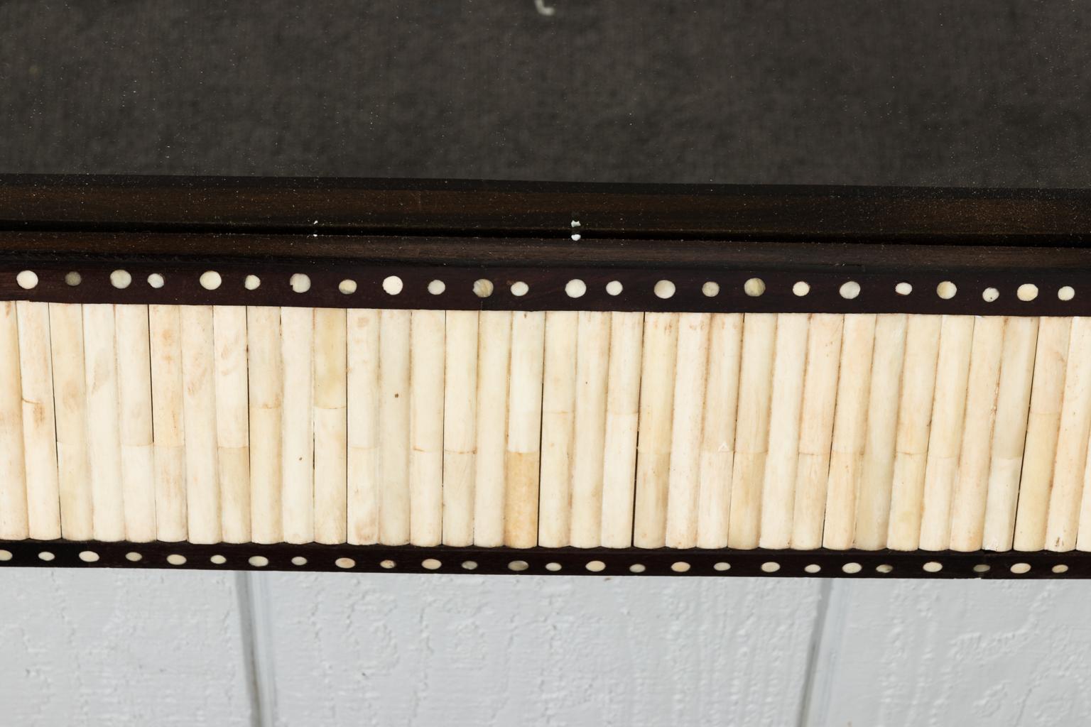 Teak mirror with bone inlaid banding.