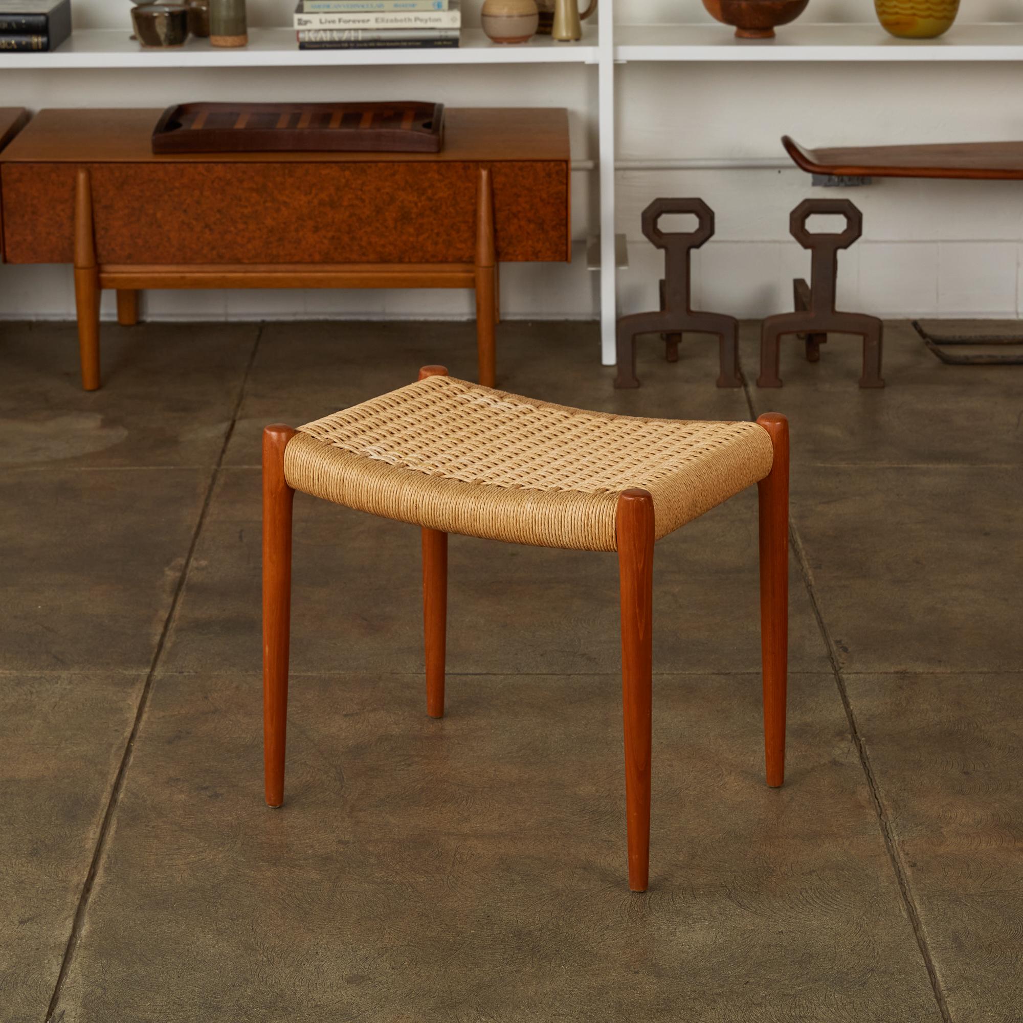 The model 80A ottoman, designed in 1963 by Niels Møller. A simple ottoman or footrest with Danish cord upholstery and slightly tapered legs, manufactured for Møller’s family company, JL Møllers Møbelfabrik of Denmark. The cord seat, made of twisted