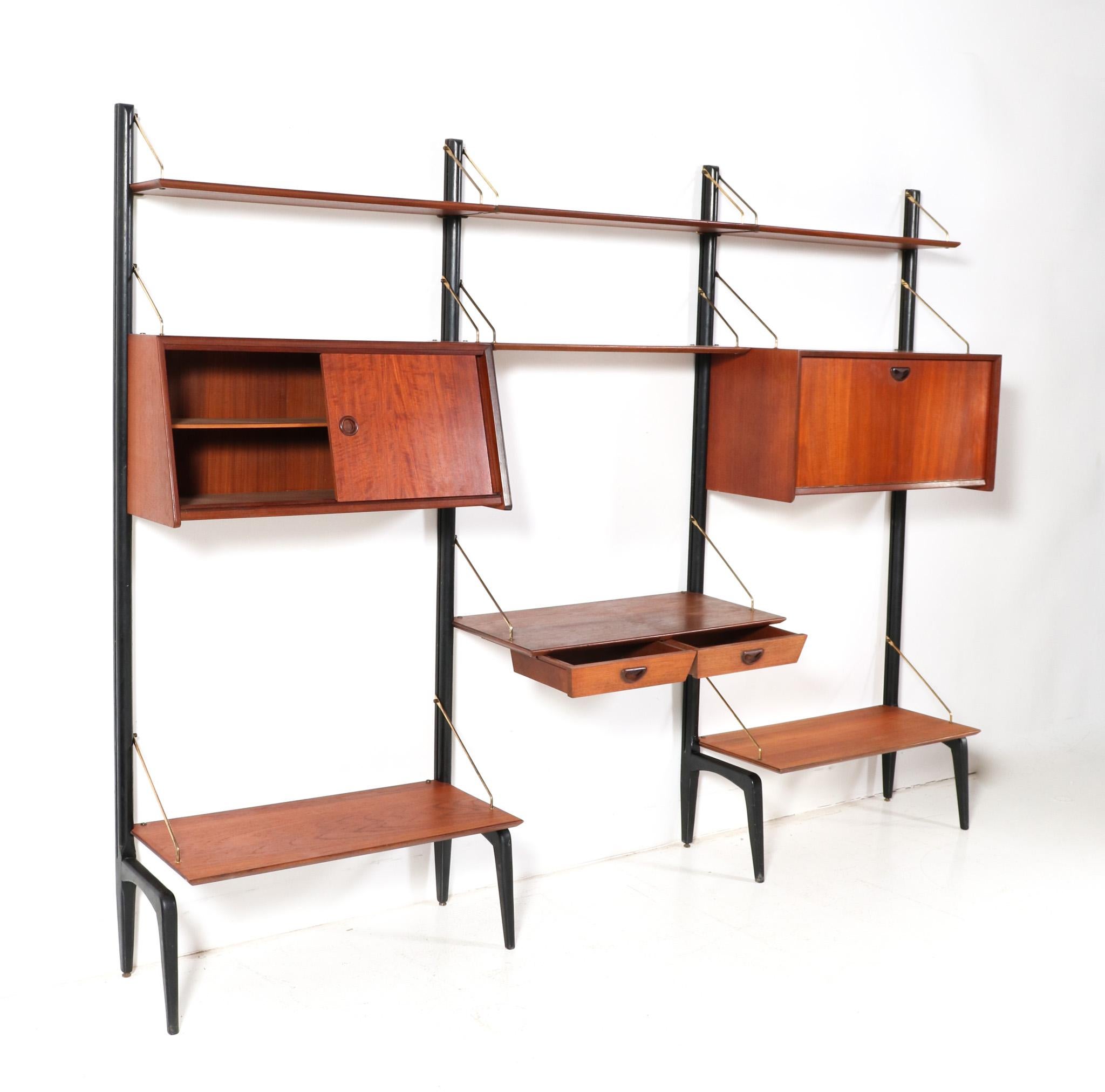 Stunning and rare Mid-Century Modern free standing modular wall unit.
Design by Louis van Teeffelen for WéBé.
Striking Dutch design from the 1950s.
This modular free standing wall unit consists of:
4 original black lacquered wooden uprights H: 200