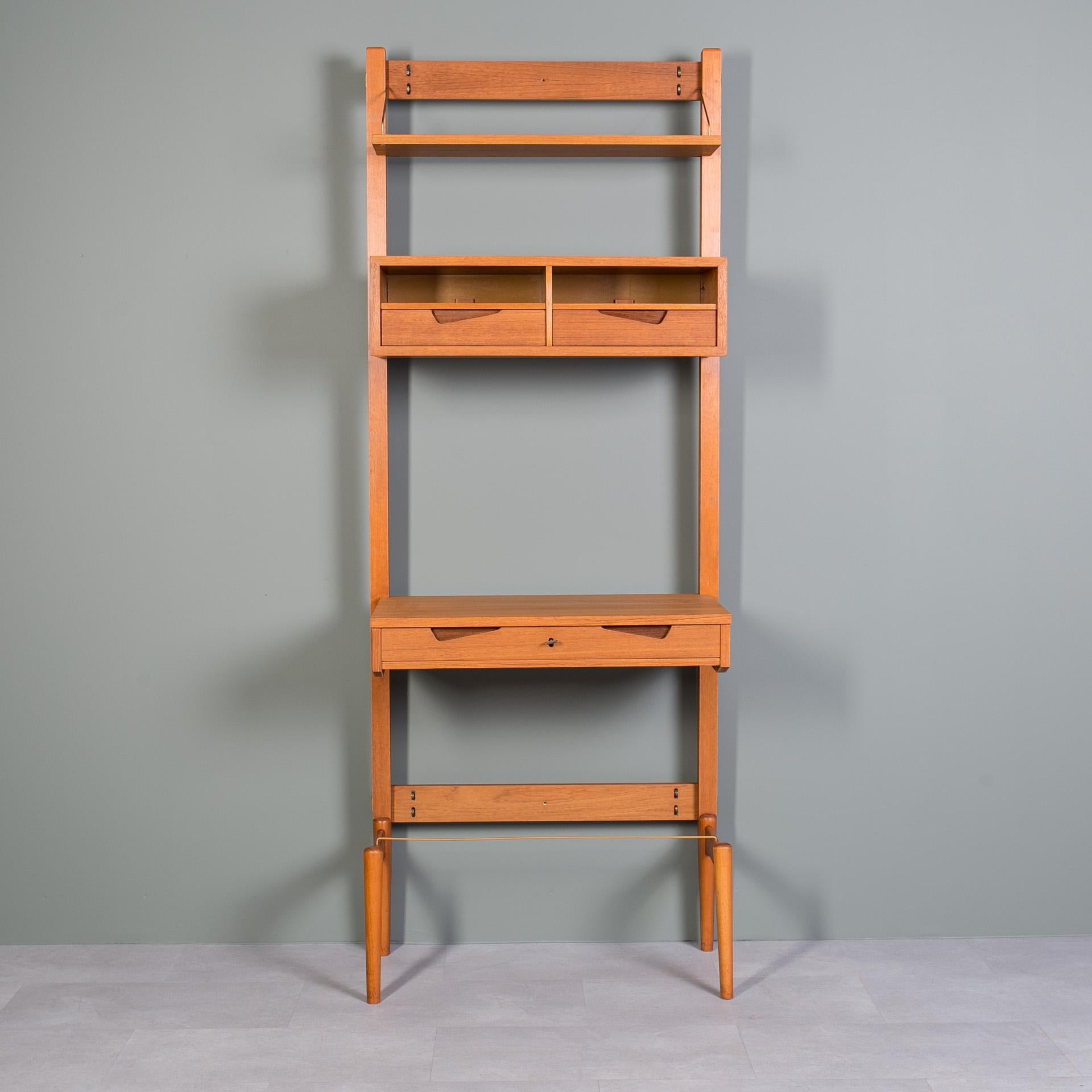 This smartly designed teak modular wall was unit produced in Norway around 1960s by Brodrene Jatogs Mobelfabrik, most probably designed by Kjell Riise (still has original label in one of the drawers). It is made of teak wood and was gently restored,